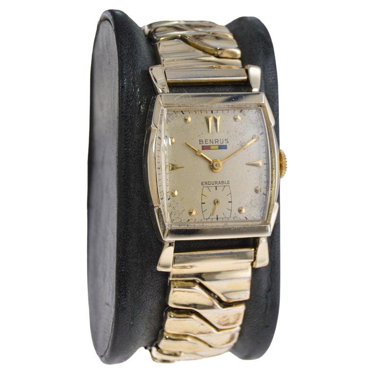 FACTORY / HOUSE: Benrus Watch Company
STYLE / REFERENCE:
METAL / MATERIAL: Yellow Gold Filled
CIRCA / YEAR: 1940's
DIMENSIONS / SIZE: 38mm Length X 26mm Width
MOVEMENT / CALIBER: Manual Winding / 17 Jewels / Caliber BA4
DIAL / HANDS: Silver