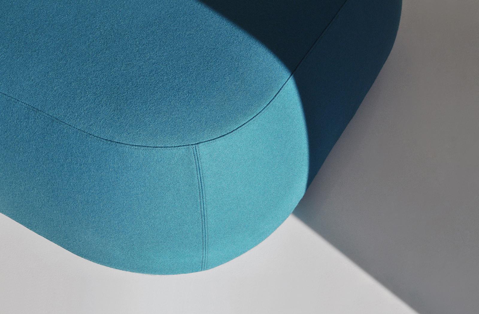 The delicate undercut at the bottom of this pouf is a detail that is not only lightens the look of the piece it also provides foot space making sitting down and standing up much easier. The Ile ottoman features a light core construction capped with