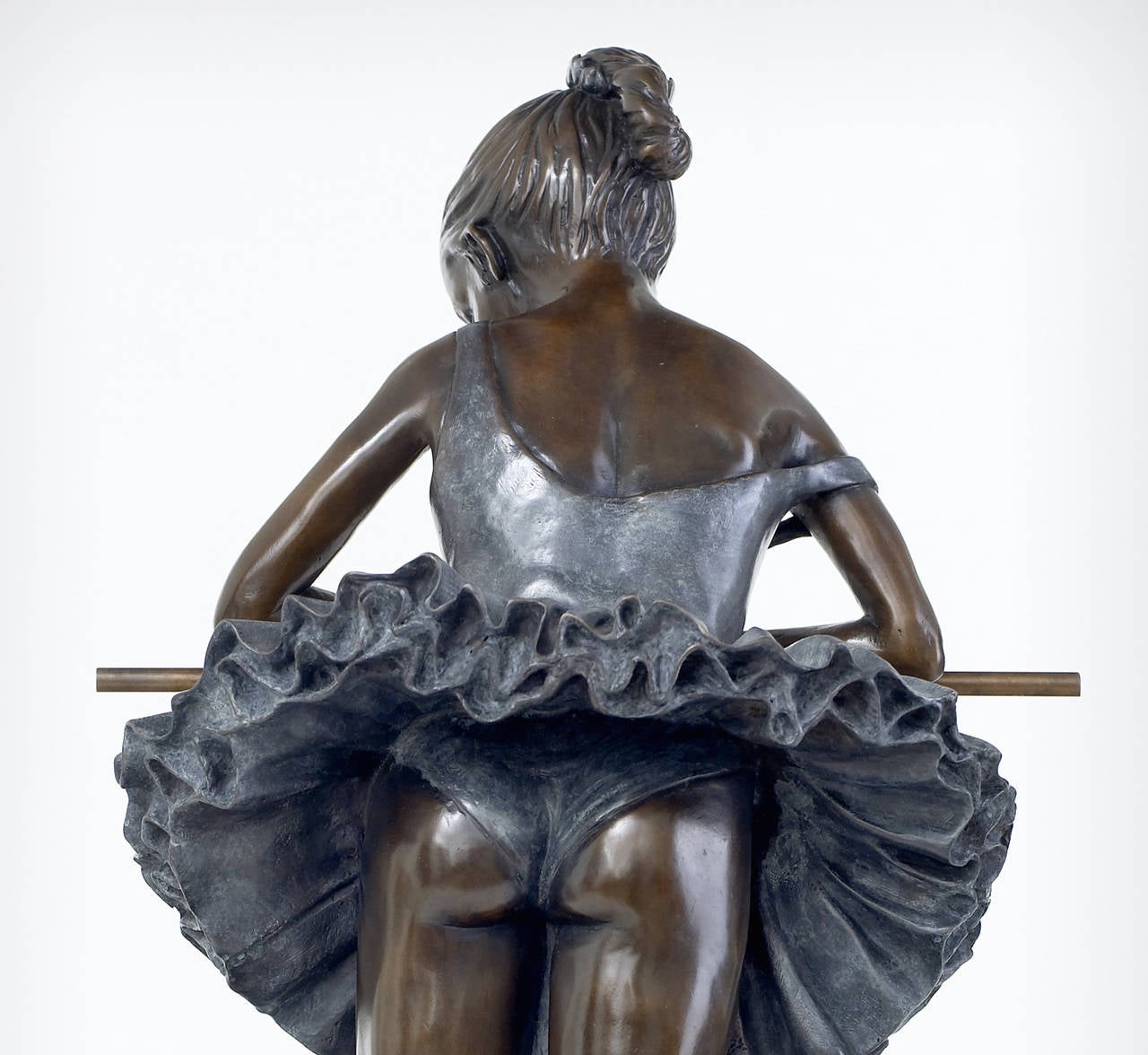 'Tutu' is a beautiful sculpture of a ballerina leaning 'en barre'. The elegance and grace of the ballerina is perfectly depicted in the sculpture.
Benson's theme is predominately the wonderful world of ballet and dancers, although some are beautiful
