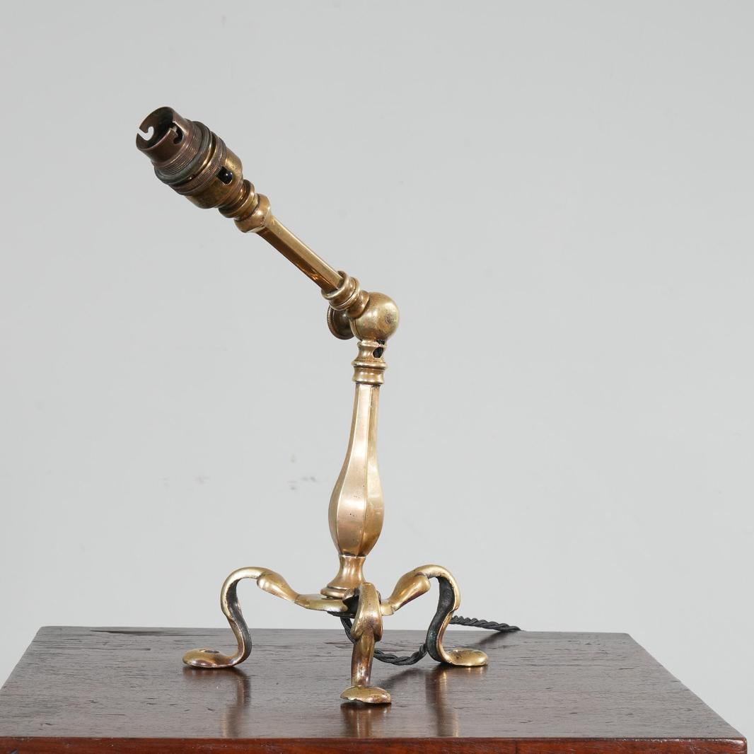 An adjustable brass table or wall light in the manner of W A S Benson.
