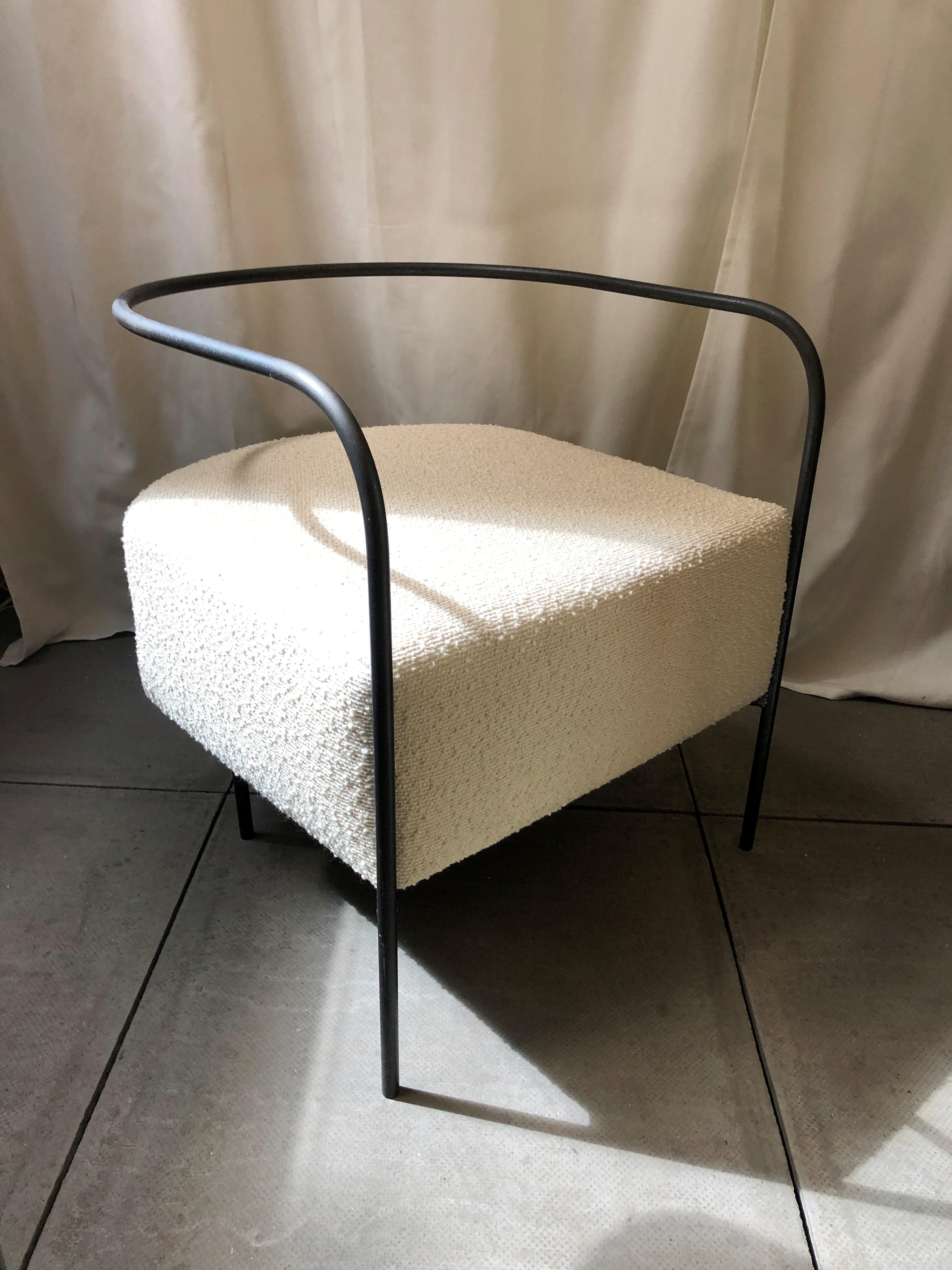 Bent armchair by Fred Rigby Studio
Dimensions: L 60 x W 60 x H 60 cm
Materials: metal, foam, bouclé.

Curved from a continuous length of metal, the back is designed to be floating and cantilevered from the front of the seat. A thick and