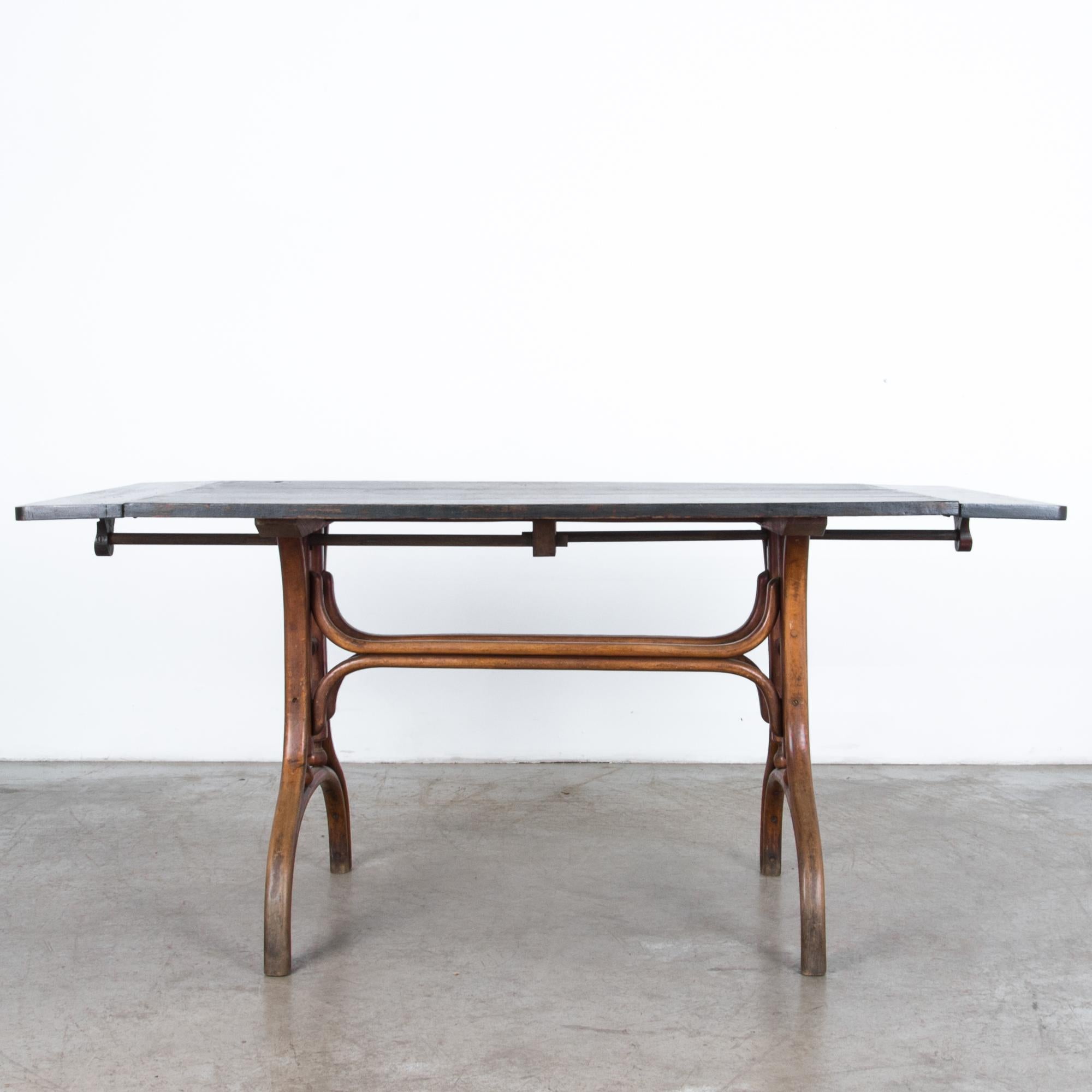 Derived from Thonet style bentwood furniture, this table originates from early 20th century, Austria. The first fashion in mass production, simple and elegant forms were created with the use of innovative modern technologies. A black painted top