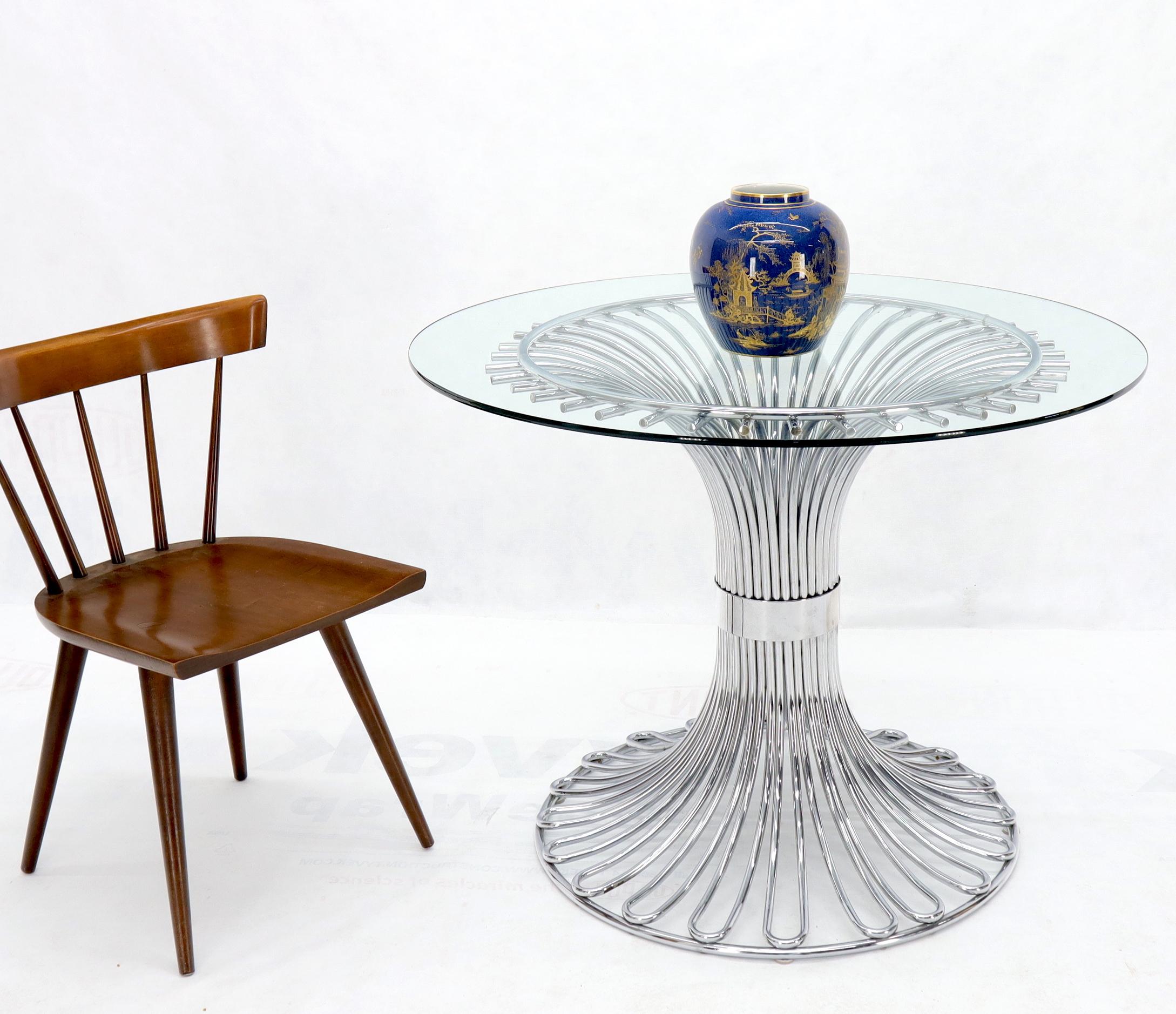 Tulip shape bent chrome tubing base glass top dining table. Pictured with 40