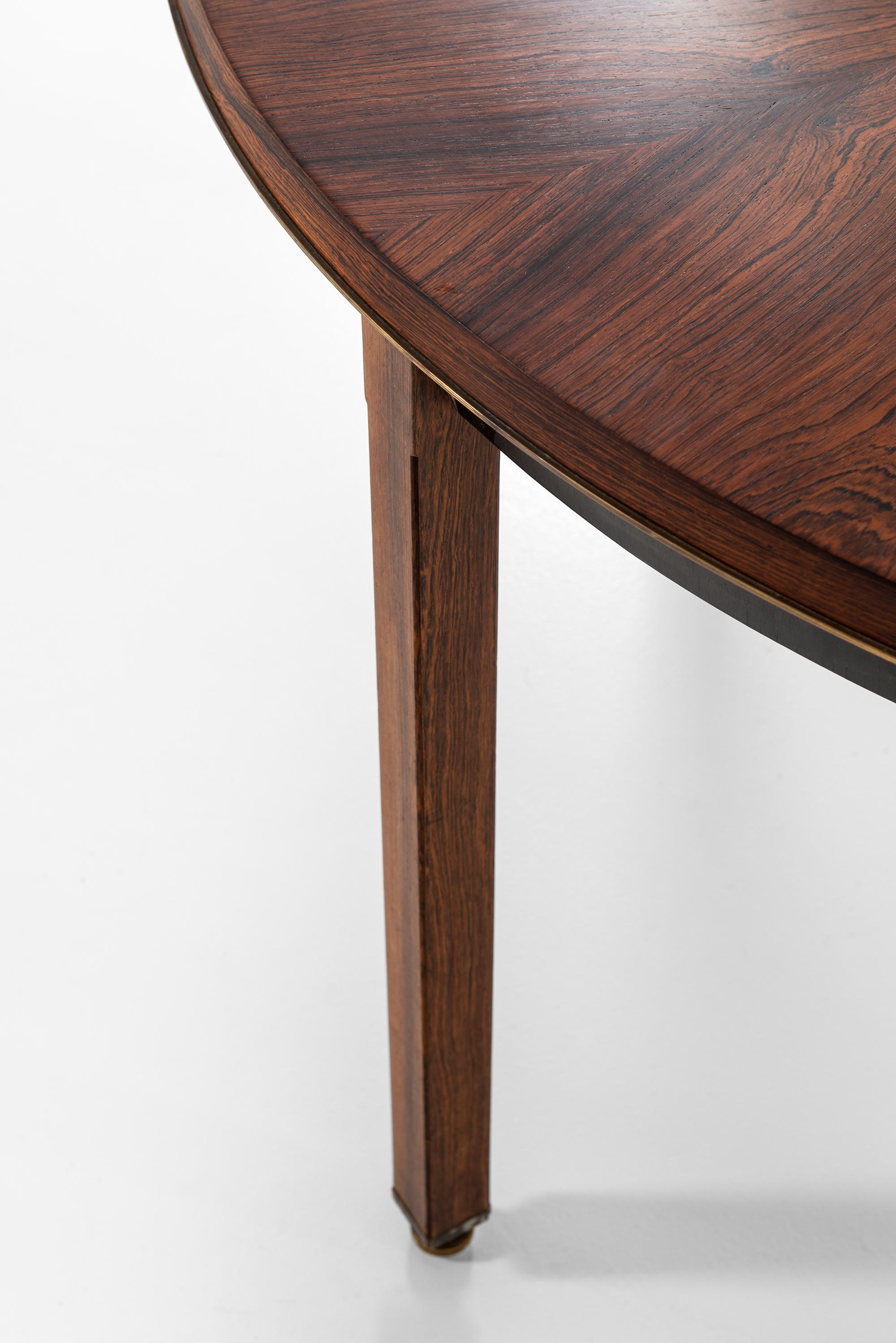 Unique dining table designed by Bent Helweg-Møller. Special order produced by cabinetmaker Jacob Kjær in Denmark.