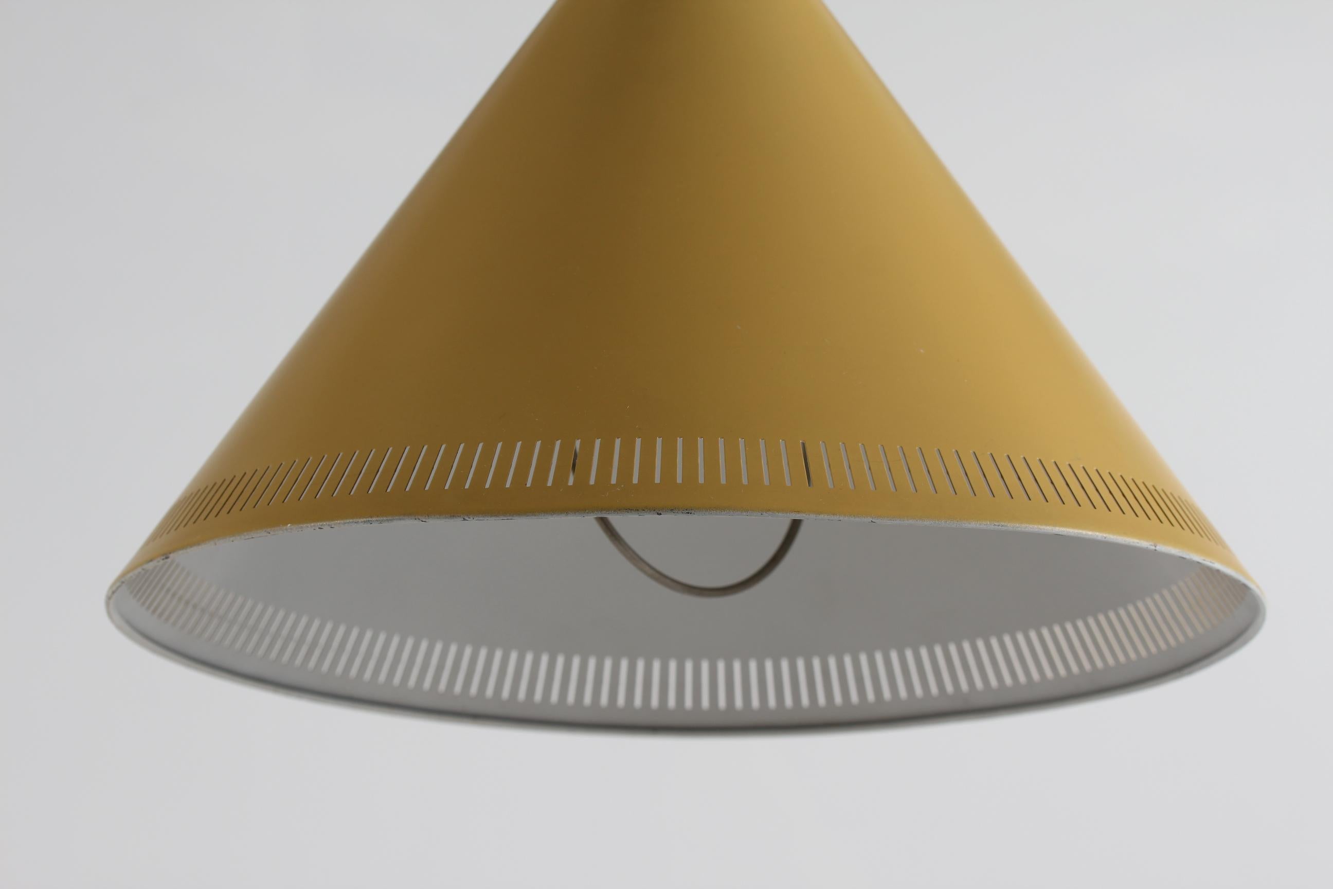 Here is a rare pair of conical pendant lights 