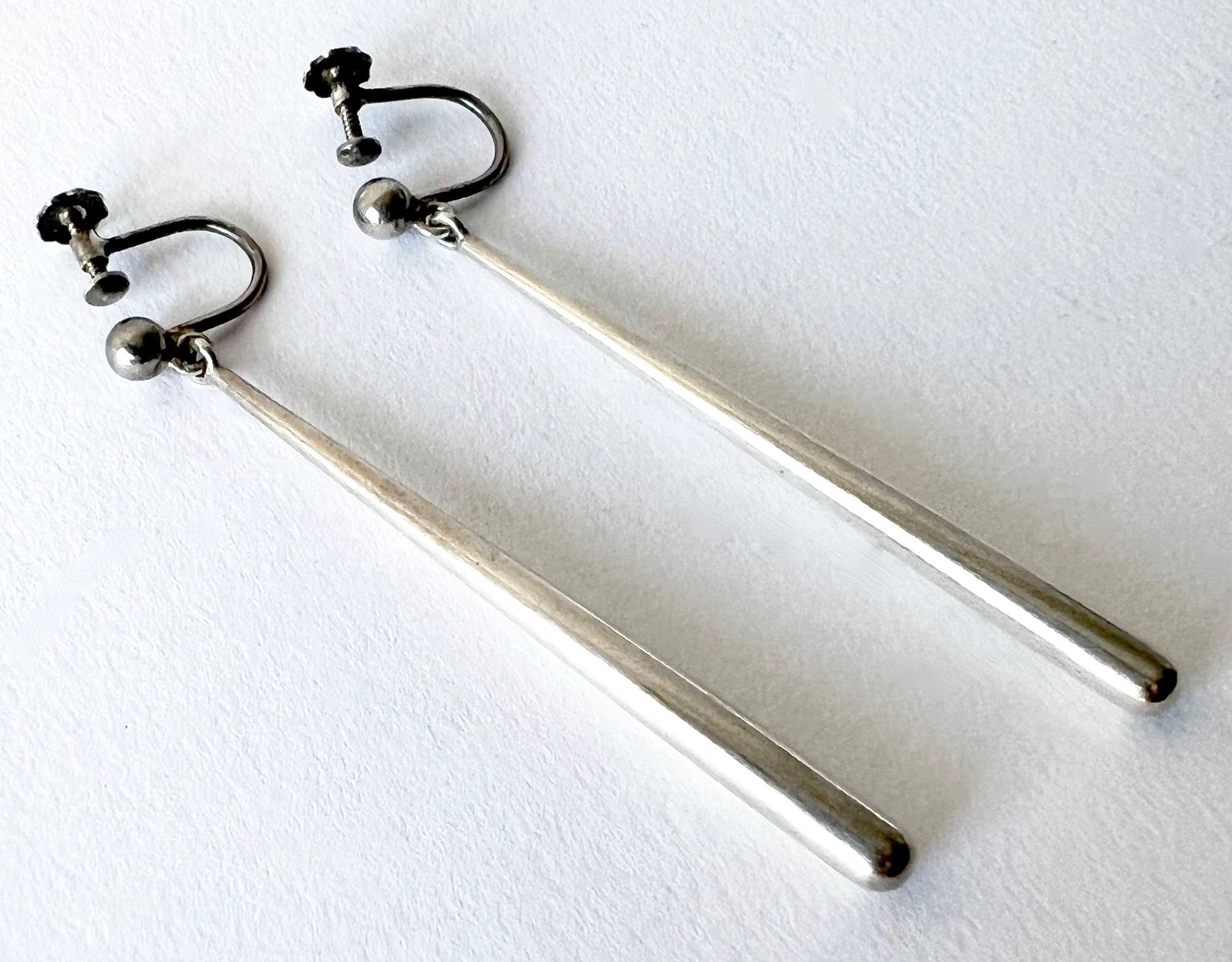 Sterling silver dangle earrings created by Bent Knudsen of Denmark circa 1960s.  Earrings have well distributed weight and are of the screwback variety. They measure 2.25