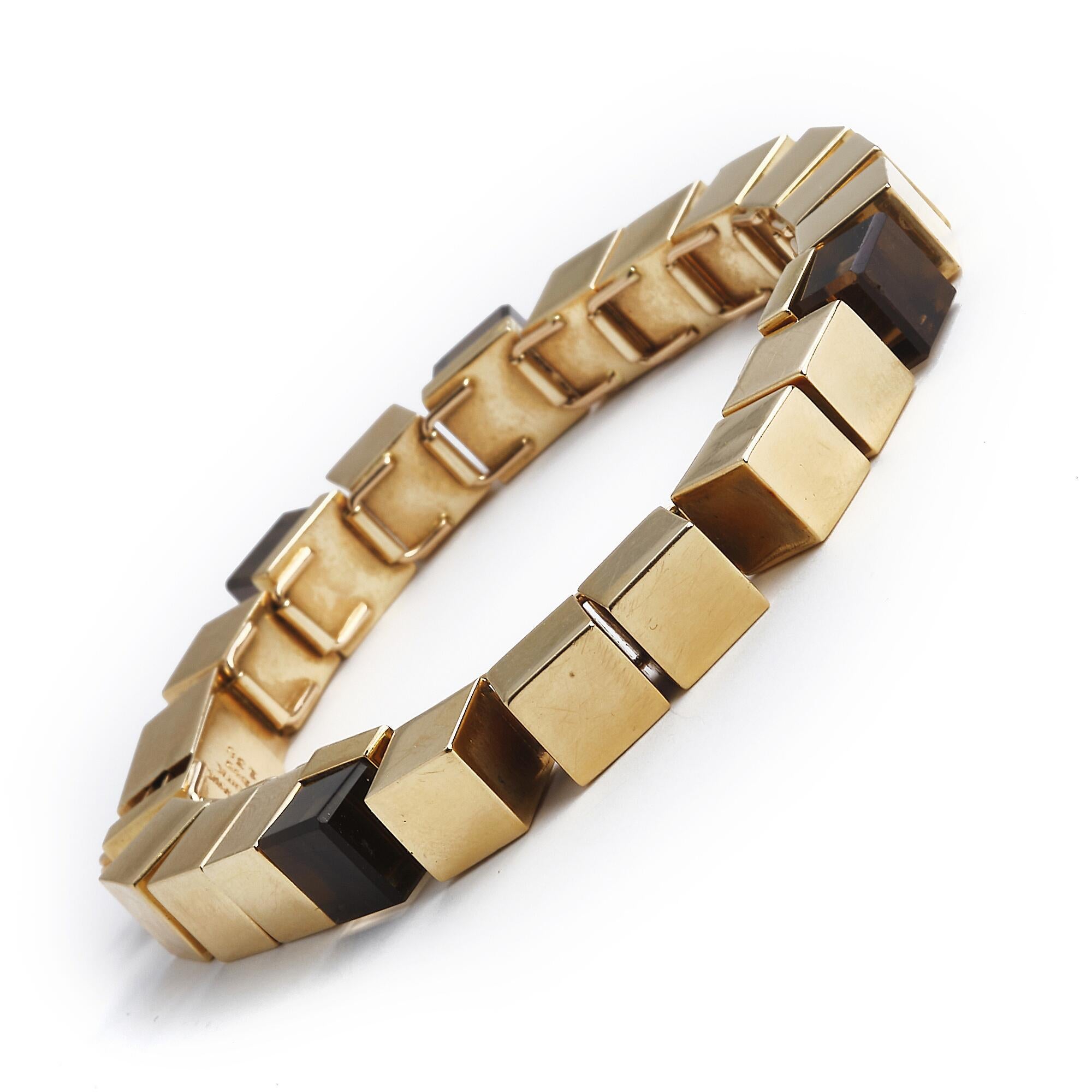 A modernist bracelet set with square-cut smokey quartz, mounted in 14k gold. Design no. 138
Marked : Denmark - BentK- 585- 138


Bent Knudsen (1924-1997) was trained as a silversmith at C.M. Cohr's in Fredericia where the work was based on