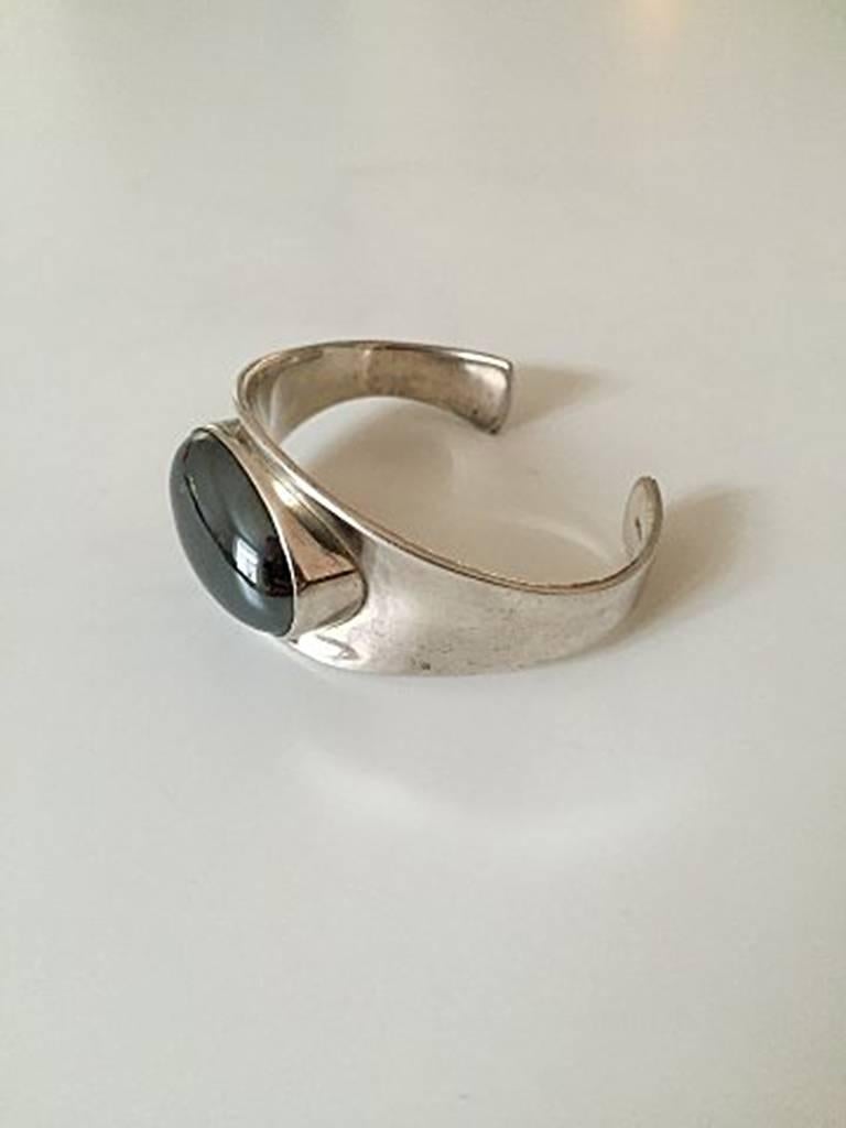 Bent Knudsen Sterling Silver Bracelet with Hematite Stone #19. Measures 6 cm / 2 23/64 in. Weighs 53.8 g / 1.90 oz. In good condition.
