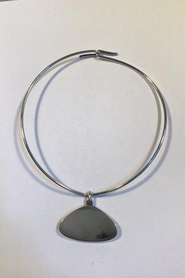 Bent Knudsen sterling silver neck ring No 55 and pendant No 32

Neck ring No 55 Diameter 12.3 cm/4.84