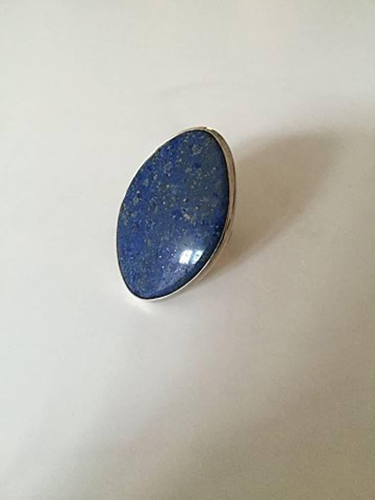Bent Knudsen Sterling Silver ring with Blue Stone #204. Ring Size can be adjusted. Measures 4.6 cm / 1 13/16 in. Weighs 21.1 g / 0.74 oz. Is in good condition.