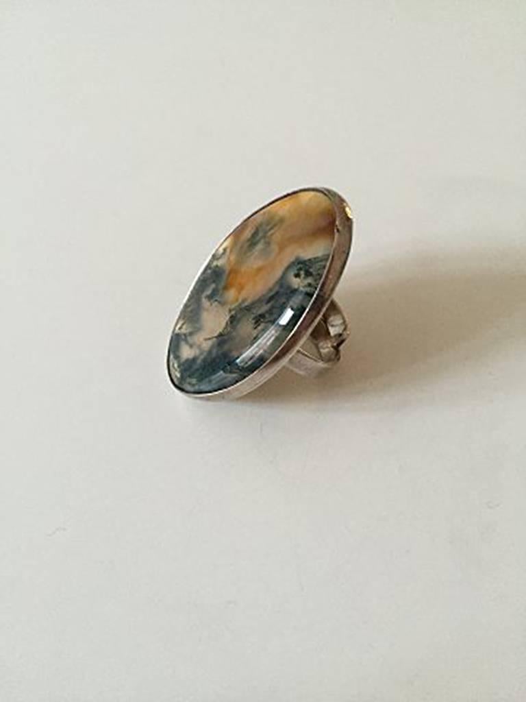 Bent Knudsen Sterling Silver ring with light stone #204. Made with open ring, so the size is variable. Measures 4.6 cm / 1 13/16 in. Weighs 23 g / 0.80 oz. Is in good condition.
