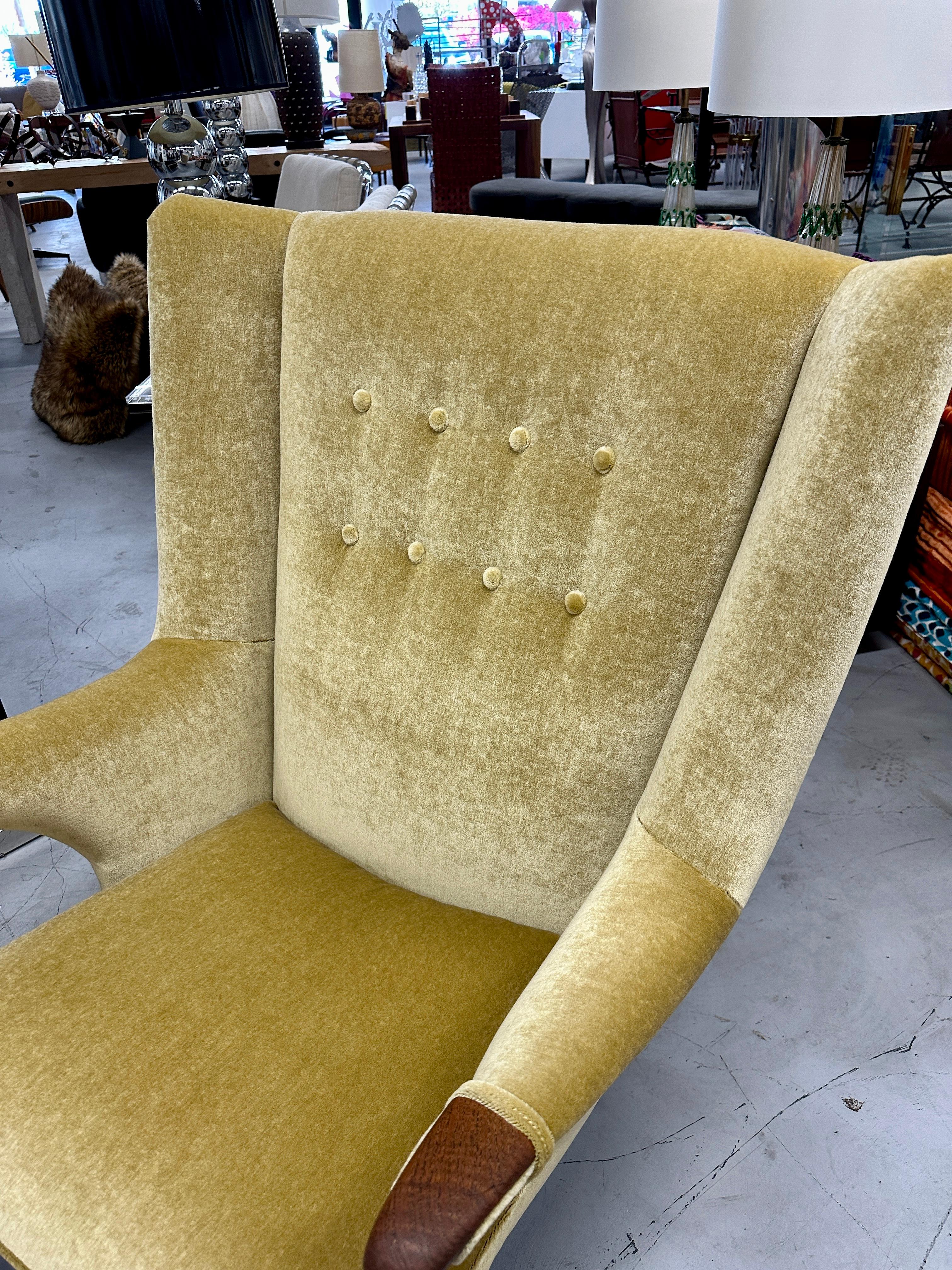 A stunning lounge chair and ottoman designed by Bent Moller Jepsen in the late 1950s and produced by Simo of Denmark. A rare early version this has been beautifully reupholstered in a 100% Wool mohair. The teak accents and legs are in good