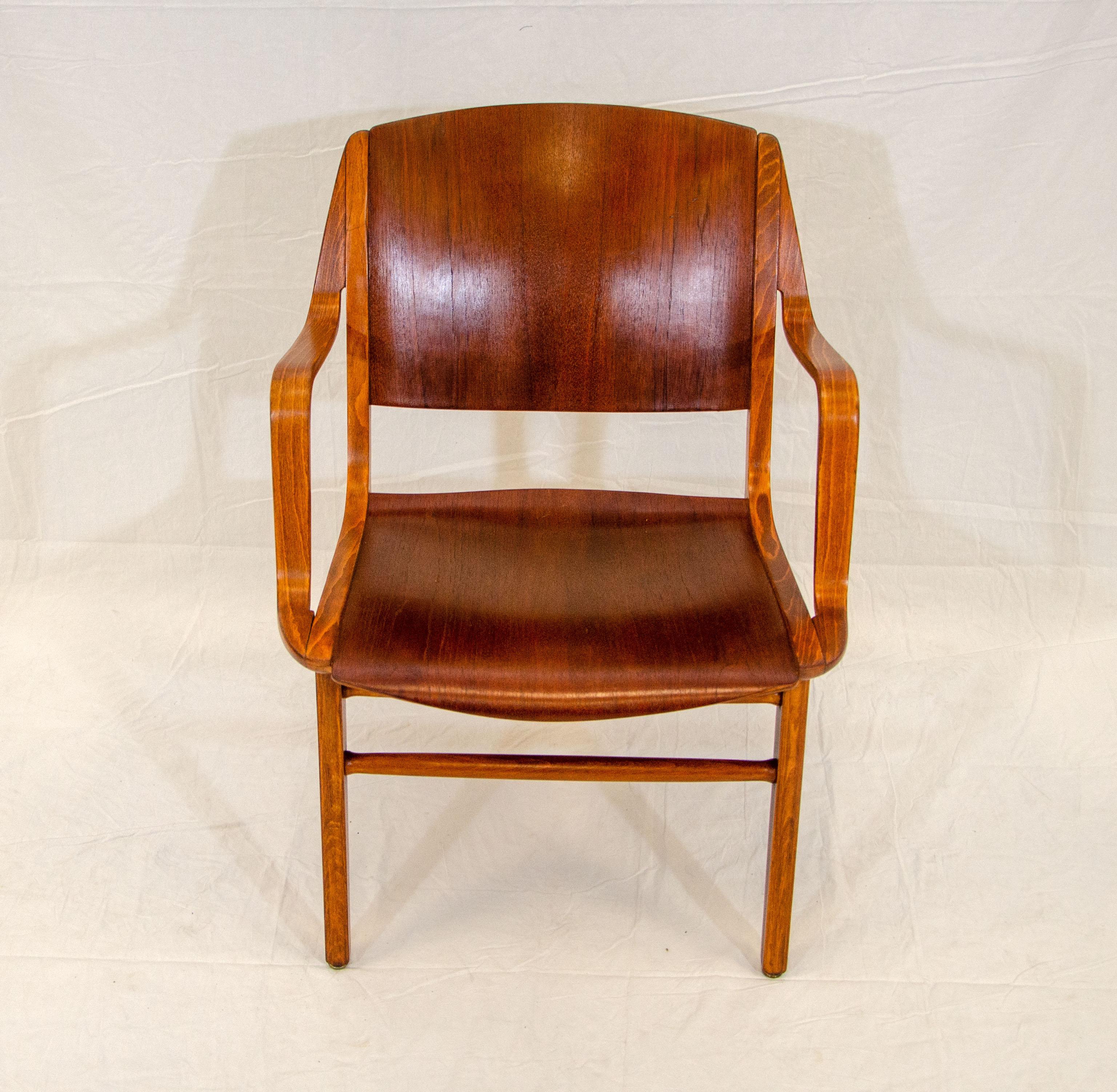 Iconic Ax armchair made of a combination of laminated beechwood and teak. Very comfortable seating. Designed in the 1950s by Peter Hvidt & Orla Mølgaard-Nielsen. An example of this chair can be found at the Museum of Design in Copenhagen.