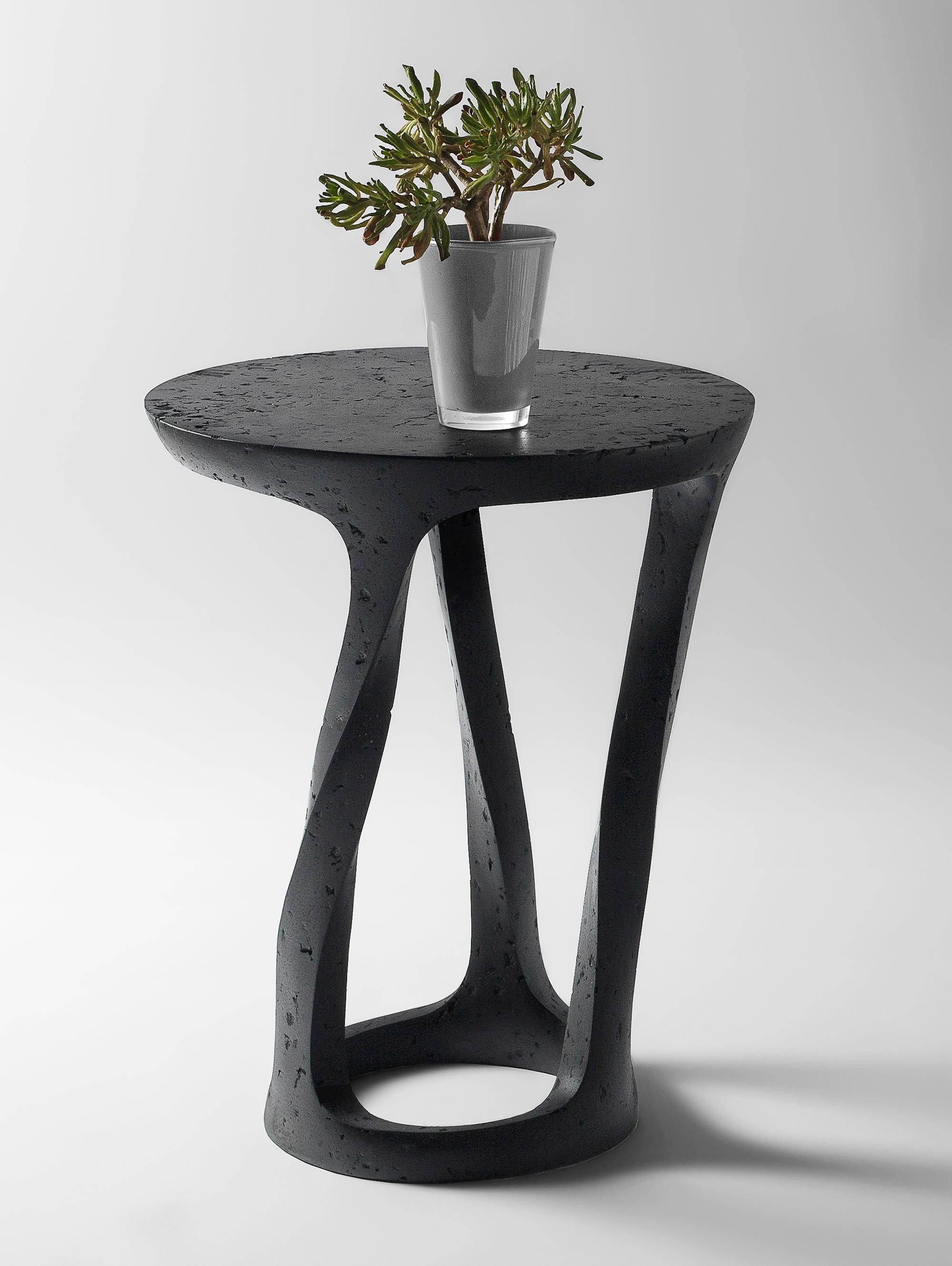 Bent Side Table by Donatas Zukauskas
Dimensions: Ø 45 x H 62 cm.
Materials: Concrete, wood, recycled paper, glue, and paint.

The fusion of sturdiness and elegance, along with the blend of archaism and modernity. More than just a surface for placing