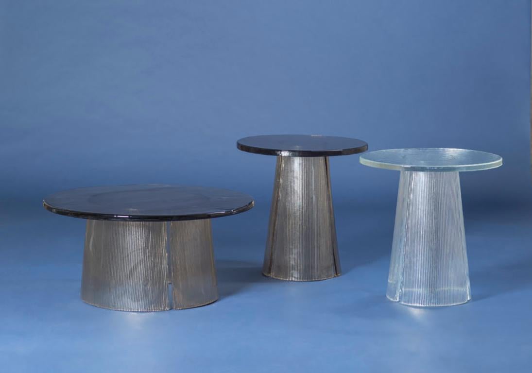bent side table, European, Minimalist, grey, German, table, big size

The bubbled surface of the cast glass tabletop dances against the smooth lines of the fluted cast glass base. The bent side table expresses the beauty of glass in all its forms.