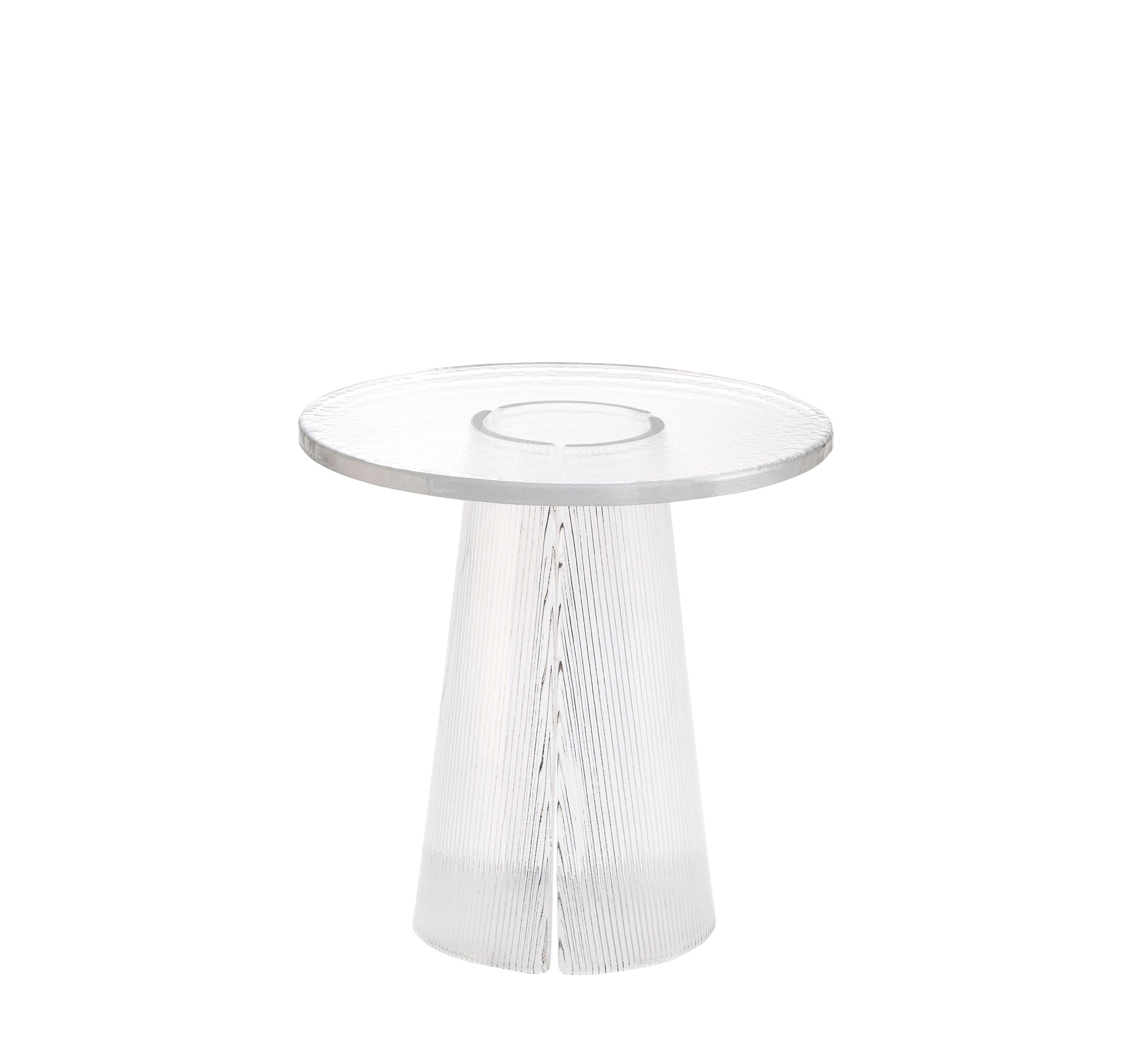 Bent side table high transparent by Pulpo
Dimensions: D50 x H51.5 cm
Materials: casted glass

Also available in different finishes and dimensions. 

The bubbled surface of the cast glass table top dances against with the smooth lines of the