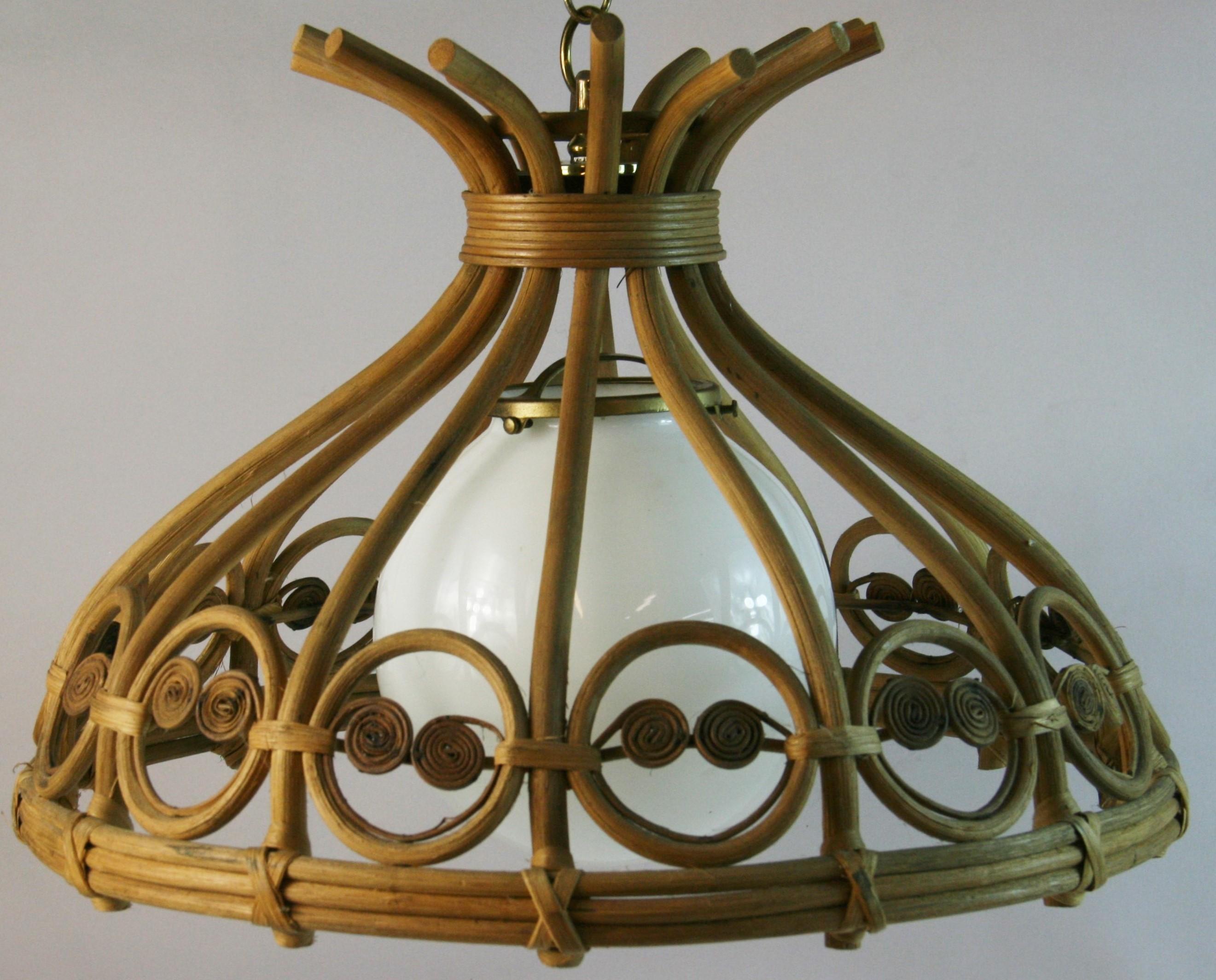 5214 MCM  bent wicker and milk glass ball pendant 1970's
Supplied with 3 feet chain and canopy
Takes one 100 watt edison based bulb
Rewired