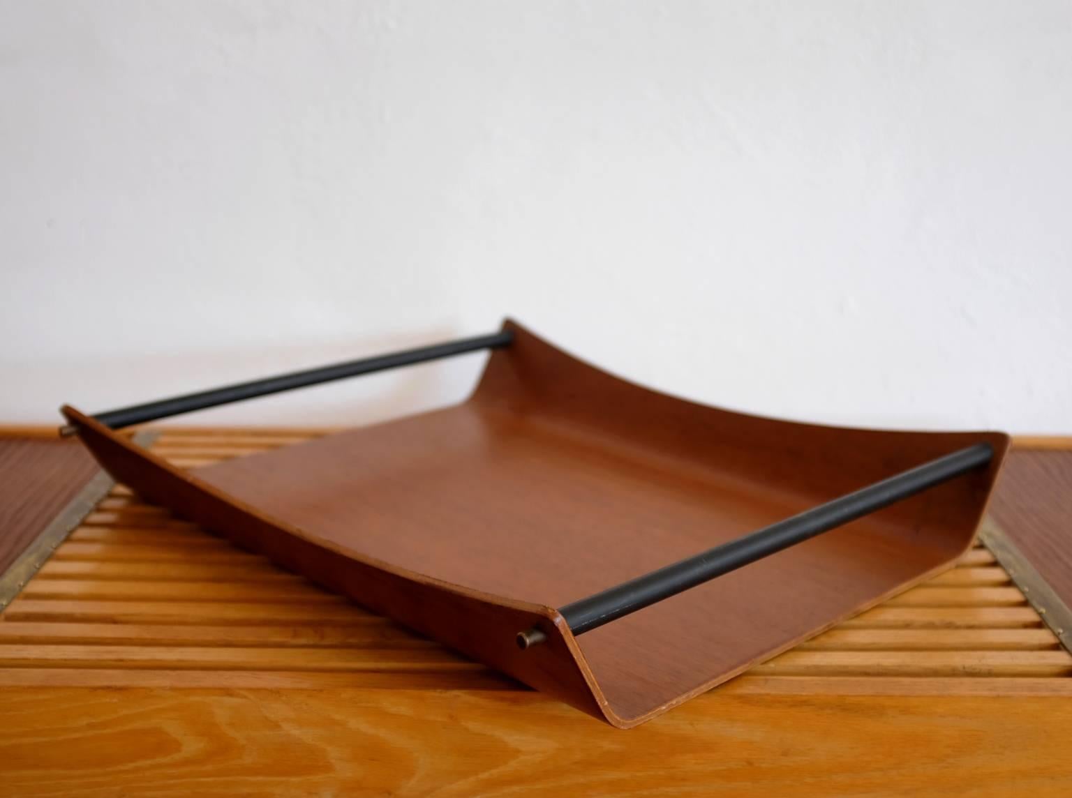 Bent ply teak wood and tubular metal catch all. A great form with an abundance of uses, 1950s.