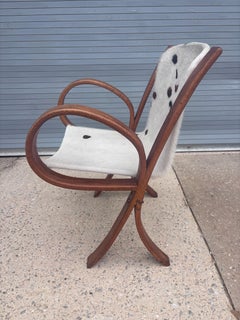 Sedia in legno curvato con seduta in pelle di vacchetta