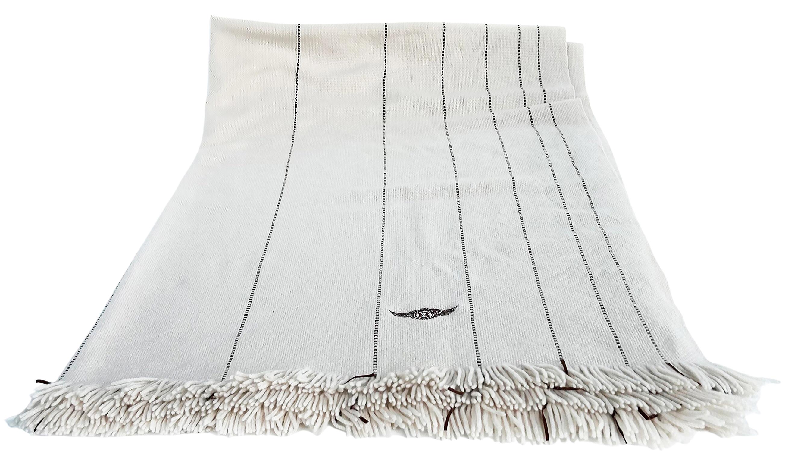 Bentley Home England Loro Piana Italy Cashmere Throw with Fringe

Offered for sale from Bentley Home is a Loro Piana cognac cashmere throw with fringe embroidered with the Bentley logo. The throw is from the Italian luxury cashmere fashion house