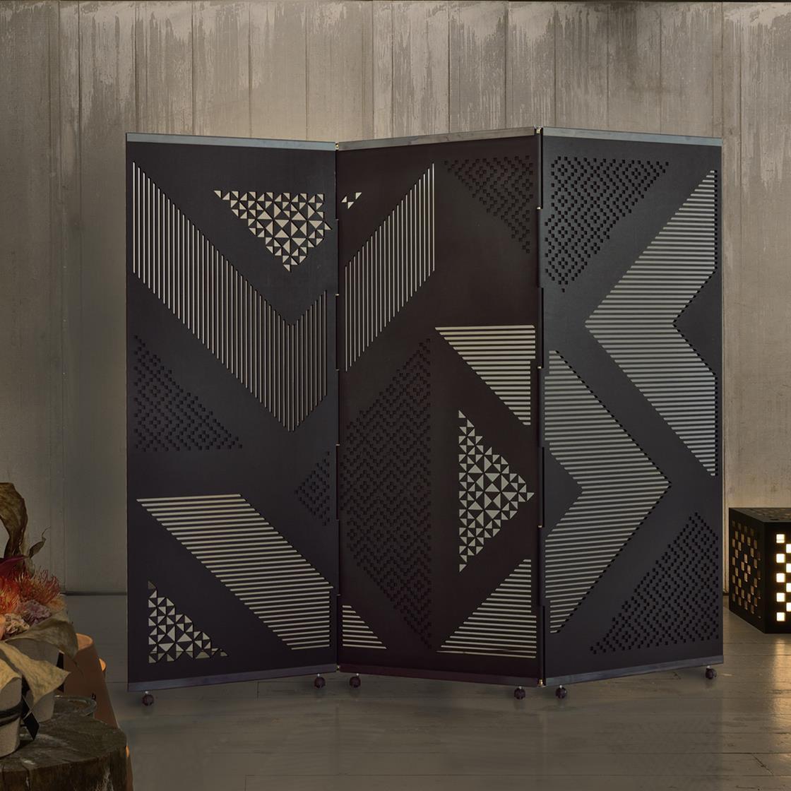 Pantographed motives from Sardinian textile tradition lend this room divider its iconic character. Fashioned of MDF and stained in black, the design will be a clever and classy solution in modern decors that will enhance intimacy while not