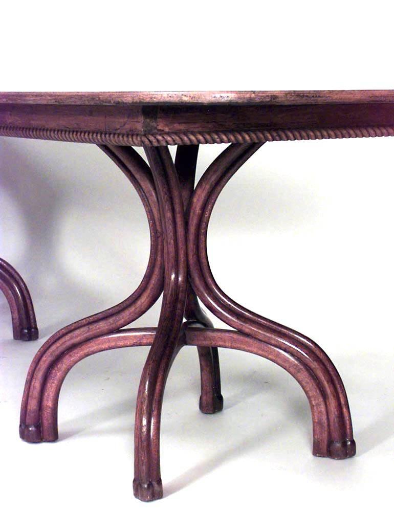Bentwood (19/20th Century) double pedestal base walnut stained dining table with rounded ends and fluted trimmed apron.
