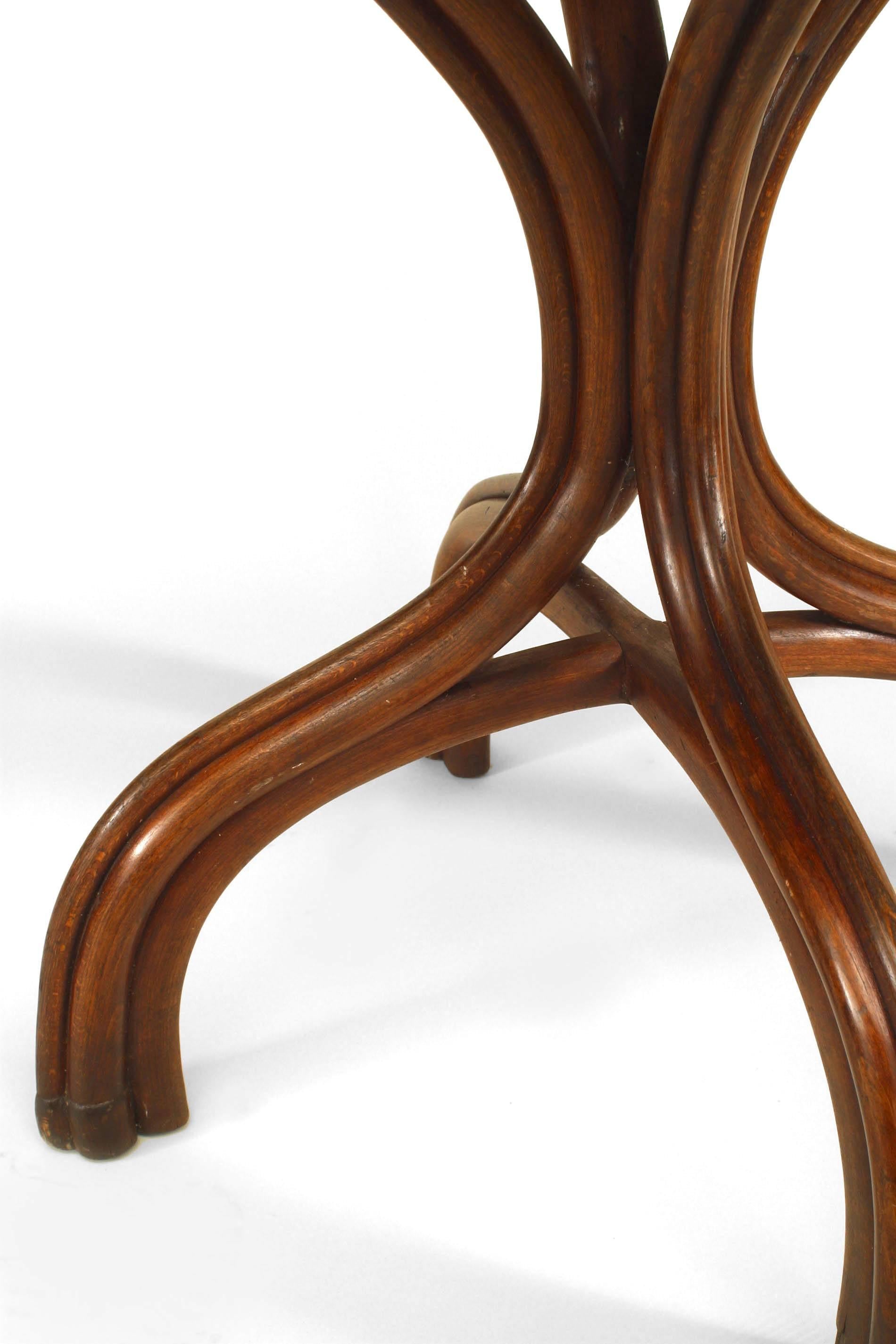 Bentwood (19/20th Century) stained walnut rectangular caf√© table with cluster design 4 leg pedestal base.
