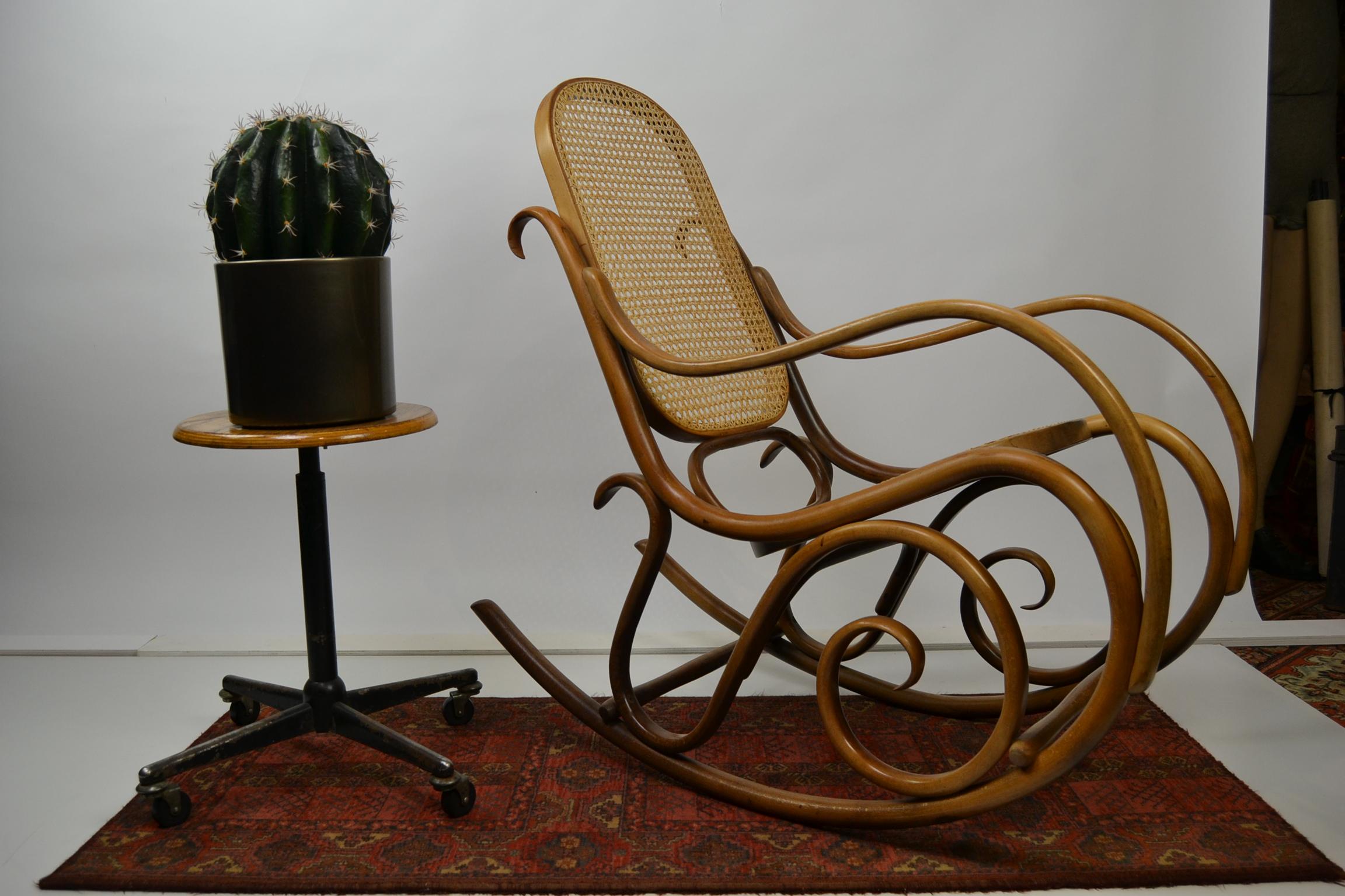 Bentwood rocking chair - rocking stool
with cane back and seating, which has been renewed, so perfect sitting.
Midcentury rocker chair in Thonet style.
Iconic model of Thonet with curling shapes, Jugenstill style.
This type of bentwood armchair