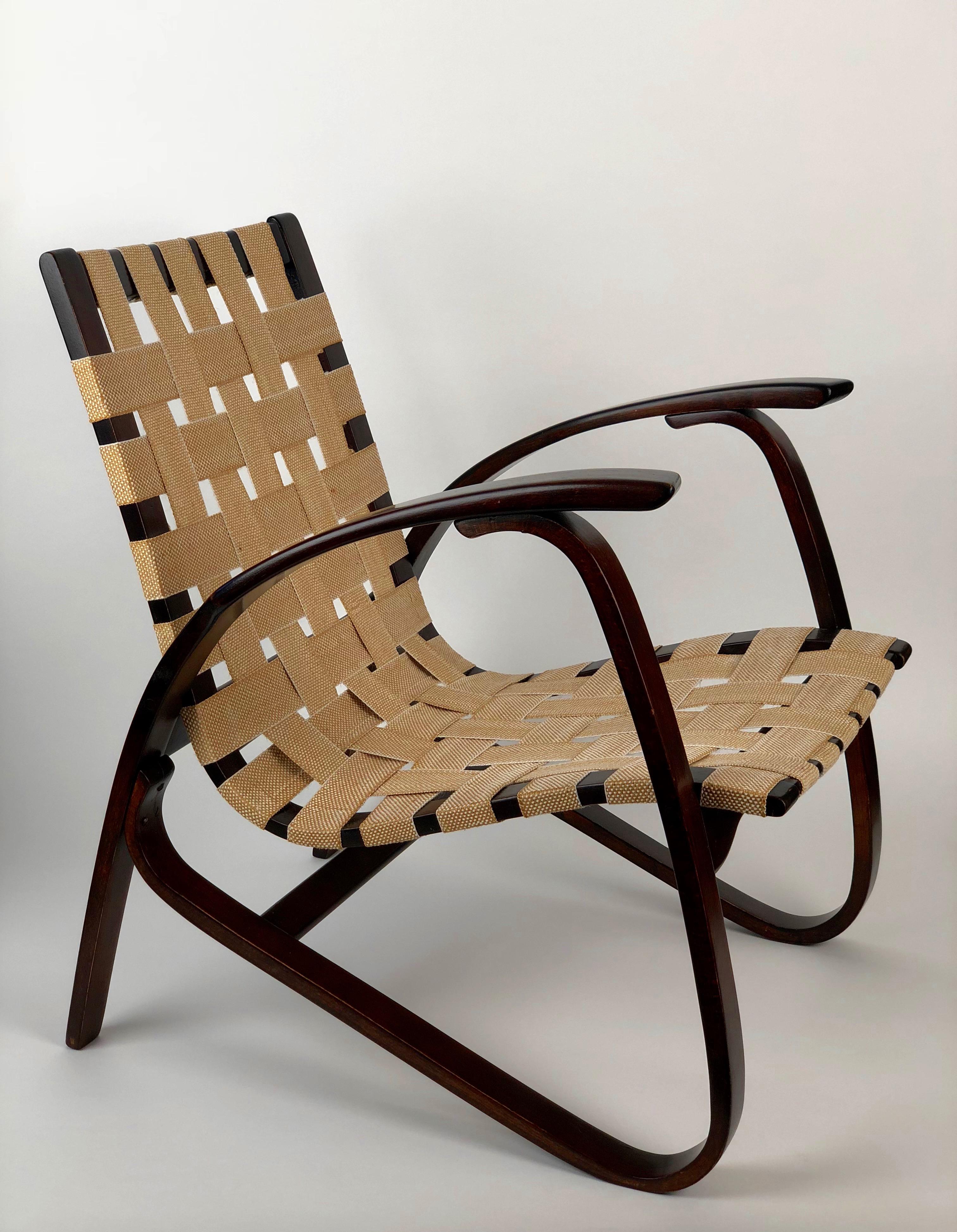 1930s bentwood armchair designed by Jan Vanek for UP Zavody. The frame is made up of steamed beechwood that has been formed into curved elements. After it's assembly it was stained brown and then the construction was finalized with webbing. At some