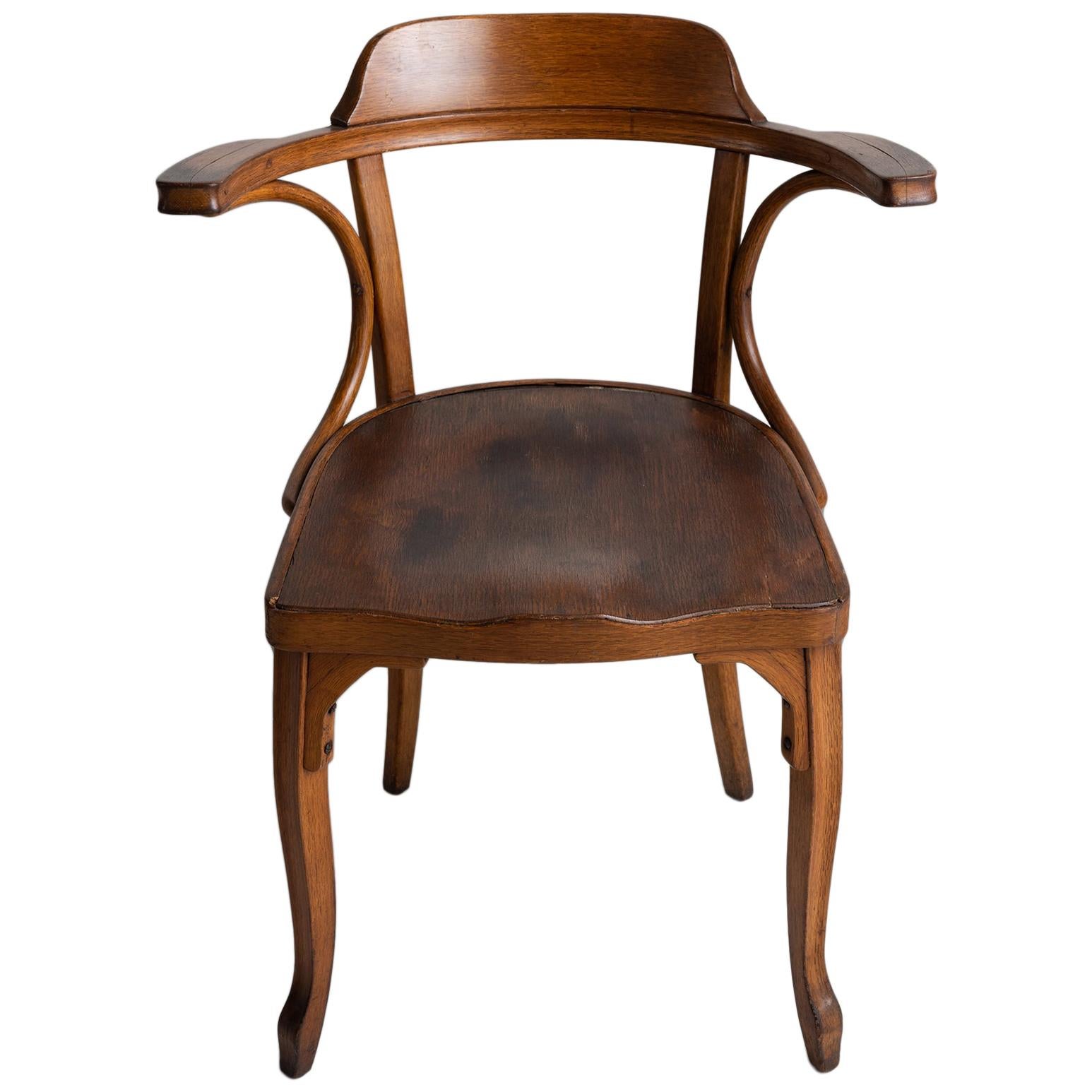 Unique bentwood armchair with elegant curves, original condition.