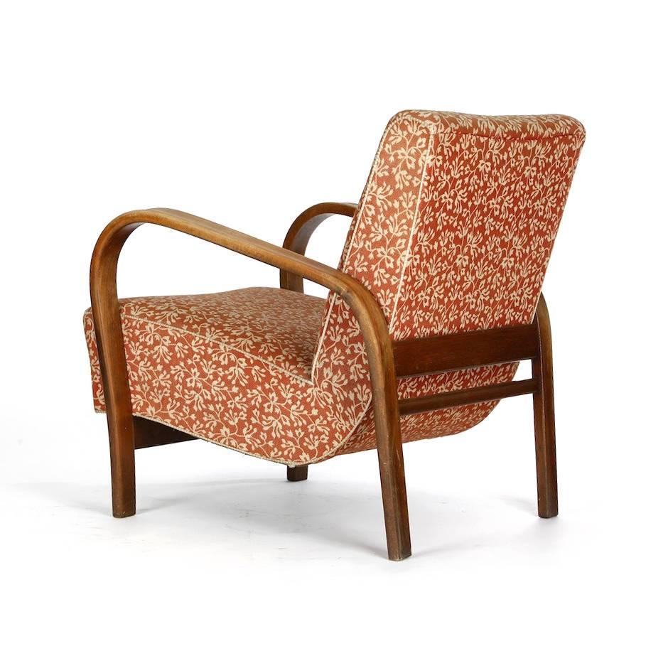 Unique armchair by a famour designer duo of the Czechoslovakian past - Karel Kozelka and Antonin Kropacek. Original condition with some fading on upholstery, but otherwise very good condition. Strong and beautiful design. Armrests of bended wood