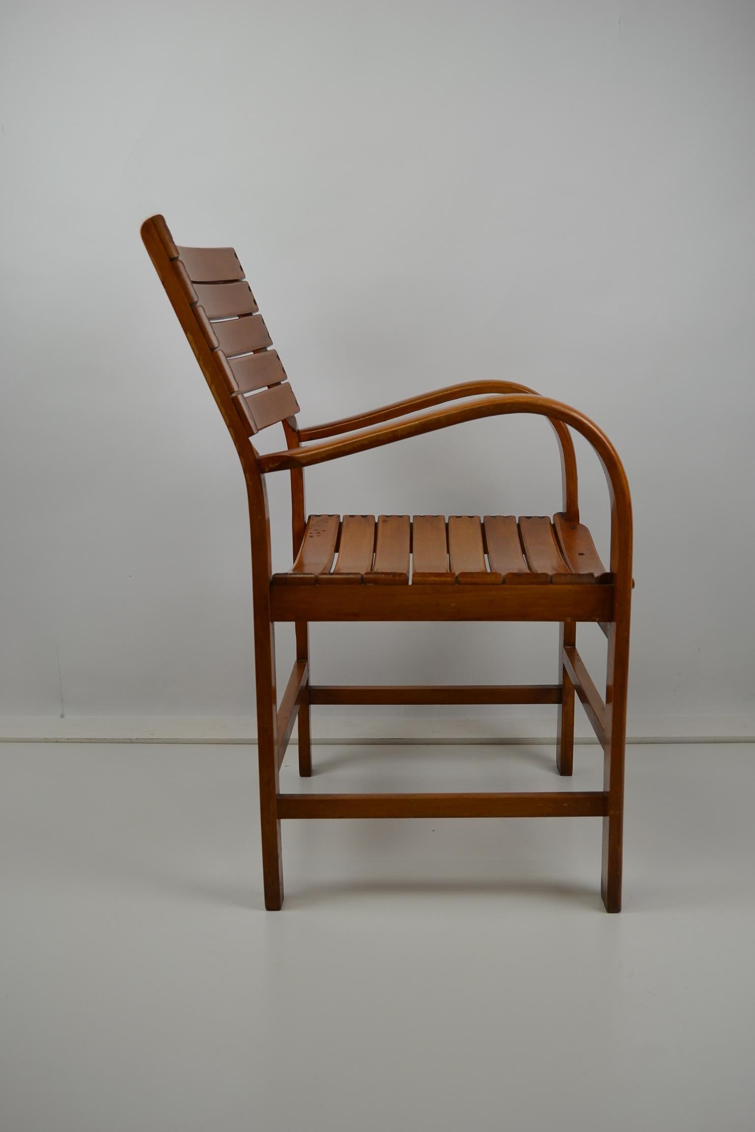 Elegant wooden armchair by Torck, Belgium. 
This adult bentwood chair has a great design and a Factory Stamp at the back.
Beautiful used Patina. 


      


    