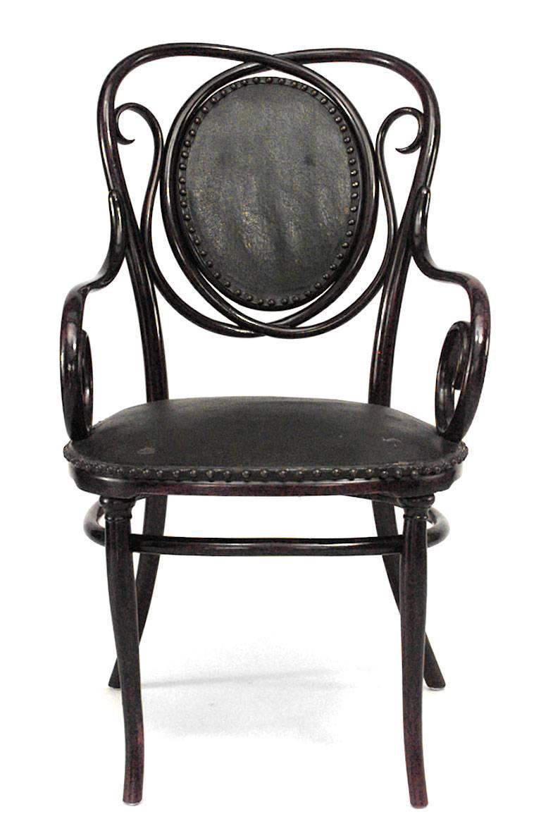 19th Century Bentwood arm chair with scroll design and black upholstered seat & back. (signed with THONET label)
