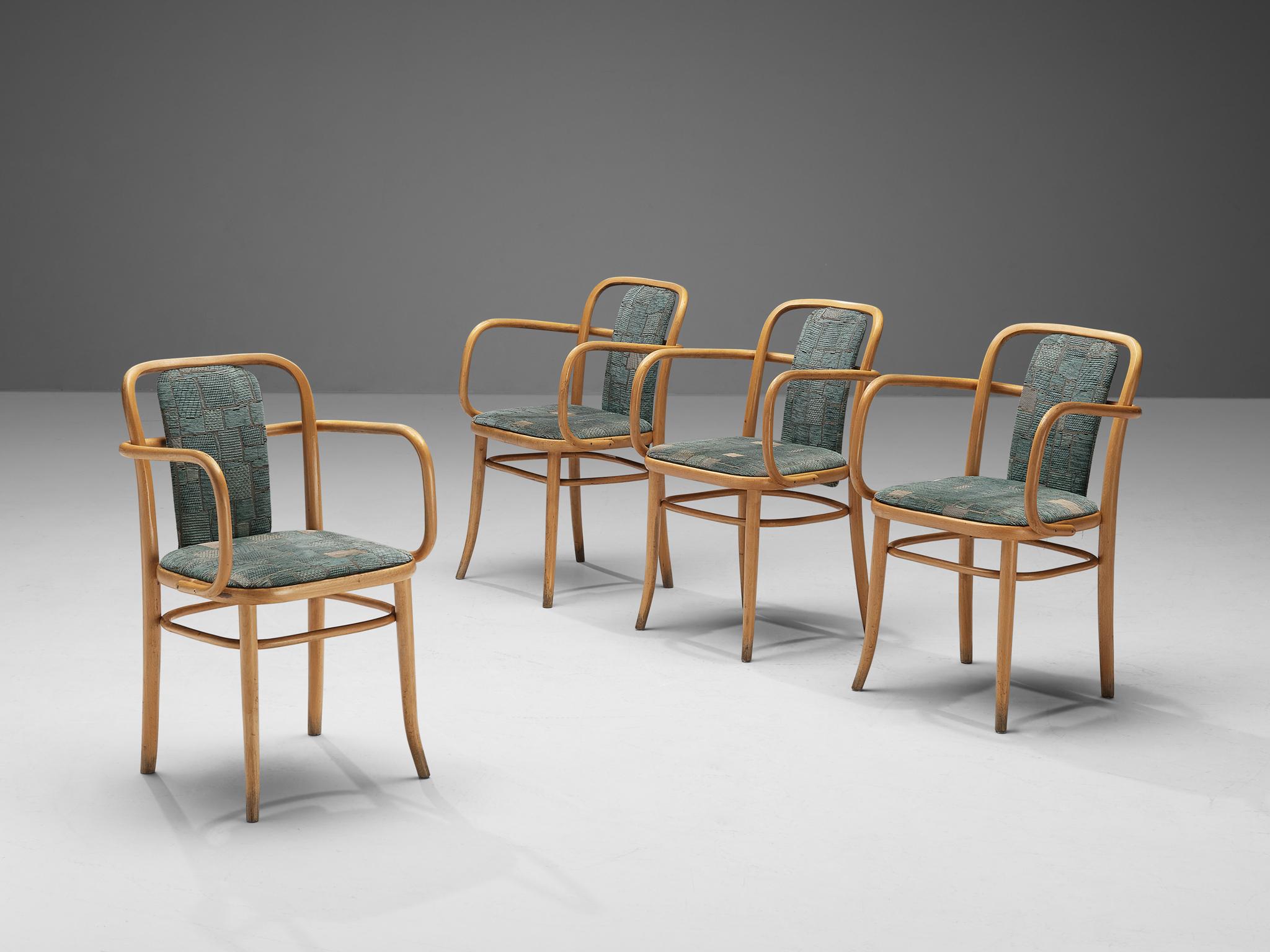 Dining chairs, bentwood and textured aquamarine upholstery, Europe, 1960s.
 
Set of four elegant armchairs in bentwood. The bentwood armrests have sinuous lines, flowing across the open backrests. With the upholstered backrest and seating the chairs