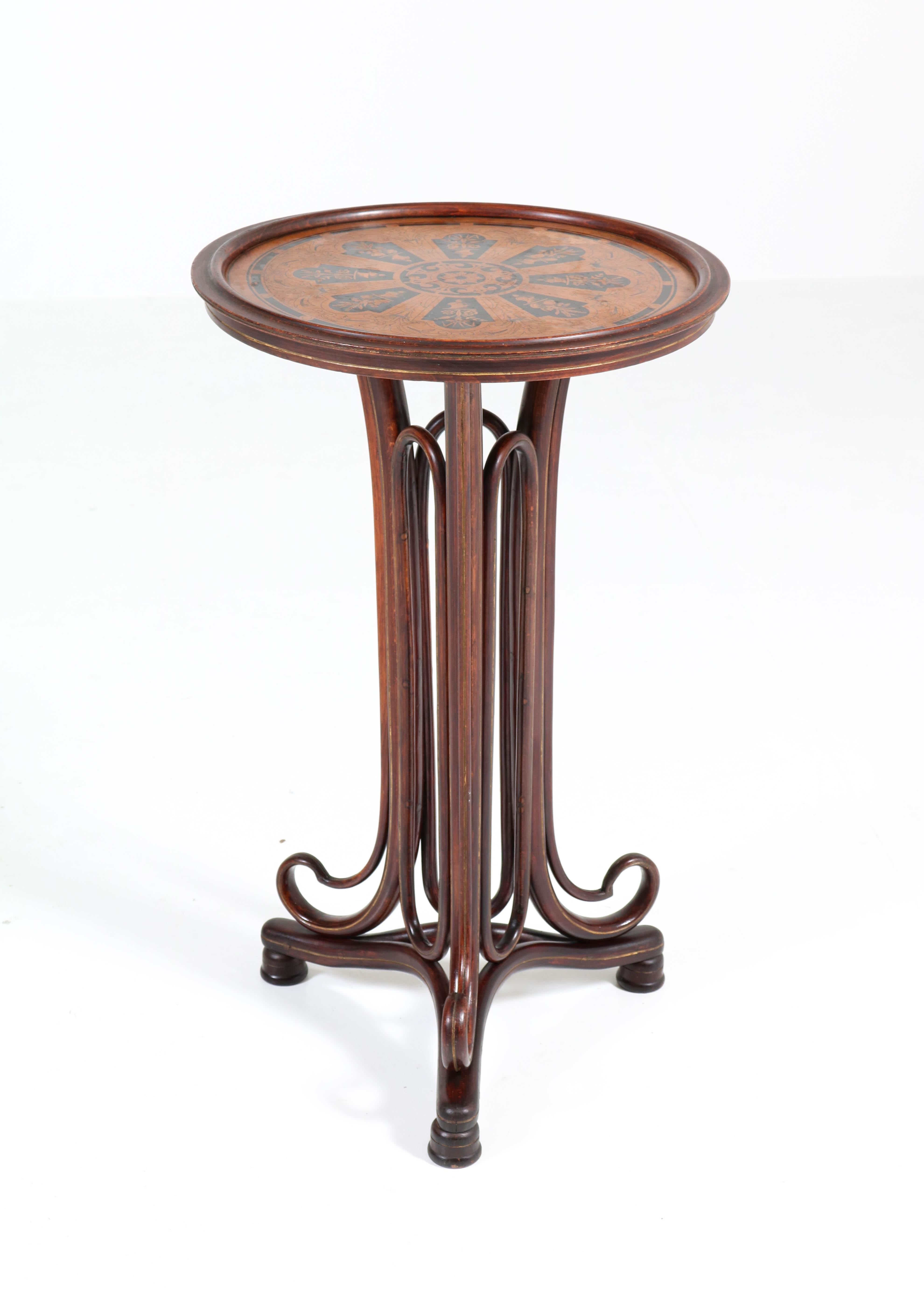 Wonderful and very rare Art Nouveau reading table.
Striking design by Thonet, Austria, 1880s.
Bentwood beech frame with original top with inlay.
Marked with original paper label, see image 11.
In good original condition with minor wear