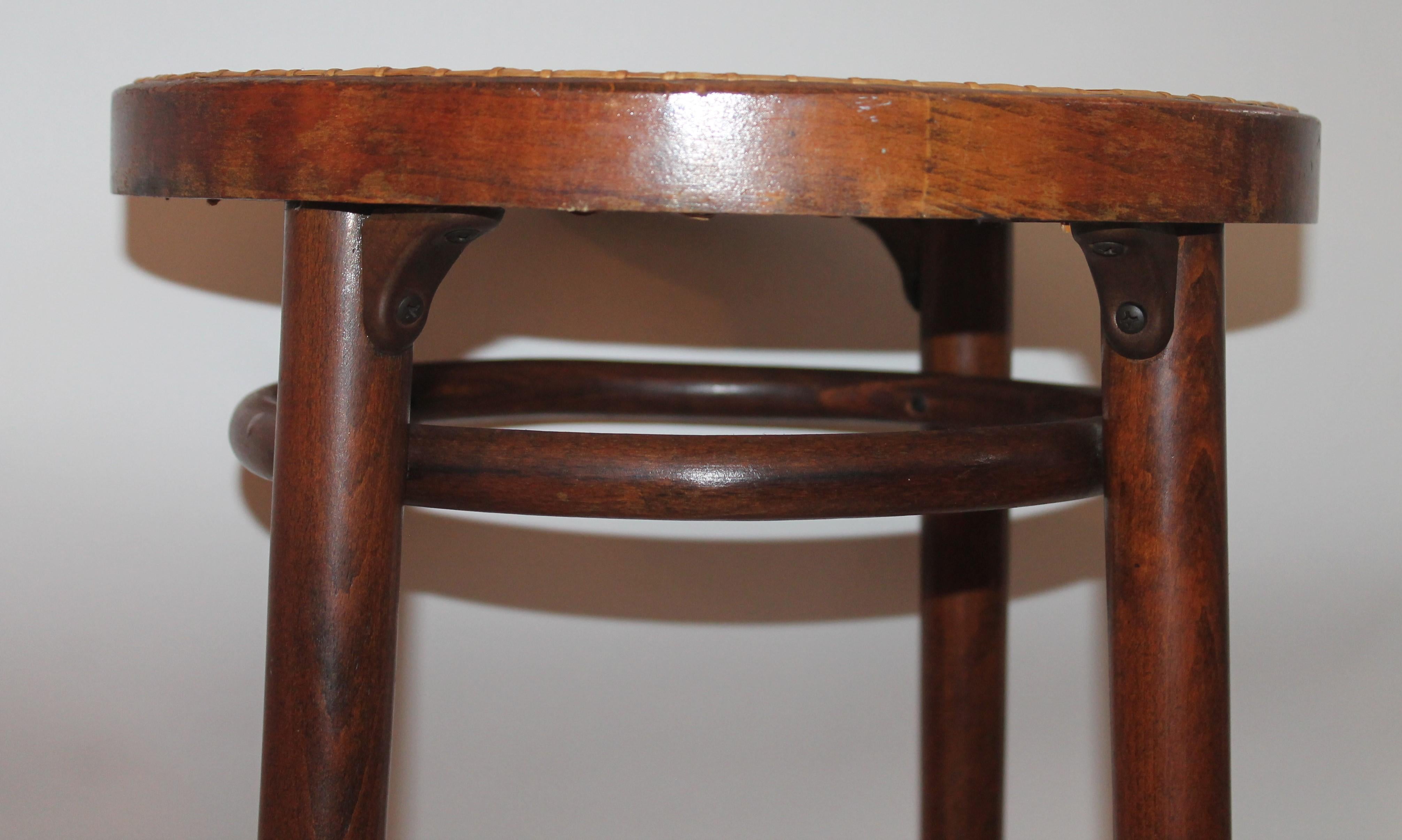 This sturdy and strong bentwood bar stool is in fine condition. The cane seat is in great condition.