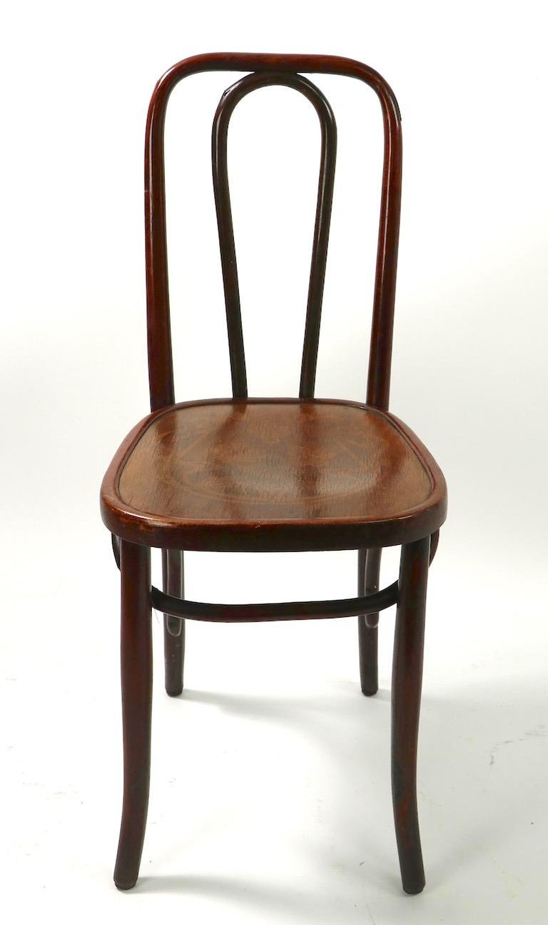 Bentwood side chair of beechwood frame with Art Nouveau motif pressed seat. Probably manufactured by JJ Kohn, or possibly Mundus, or Thonet, unsigned. This example is in very fine original condition, showing only light wear normal and consistent