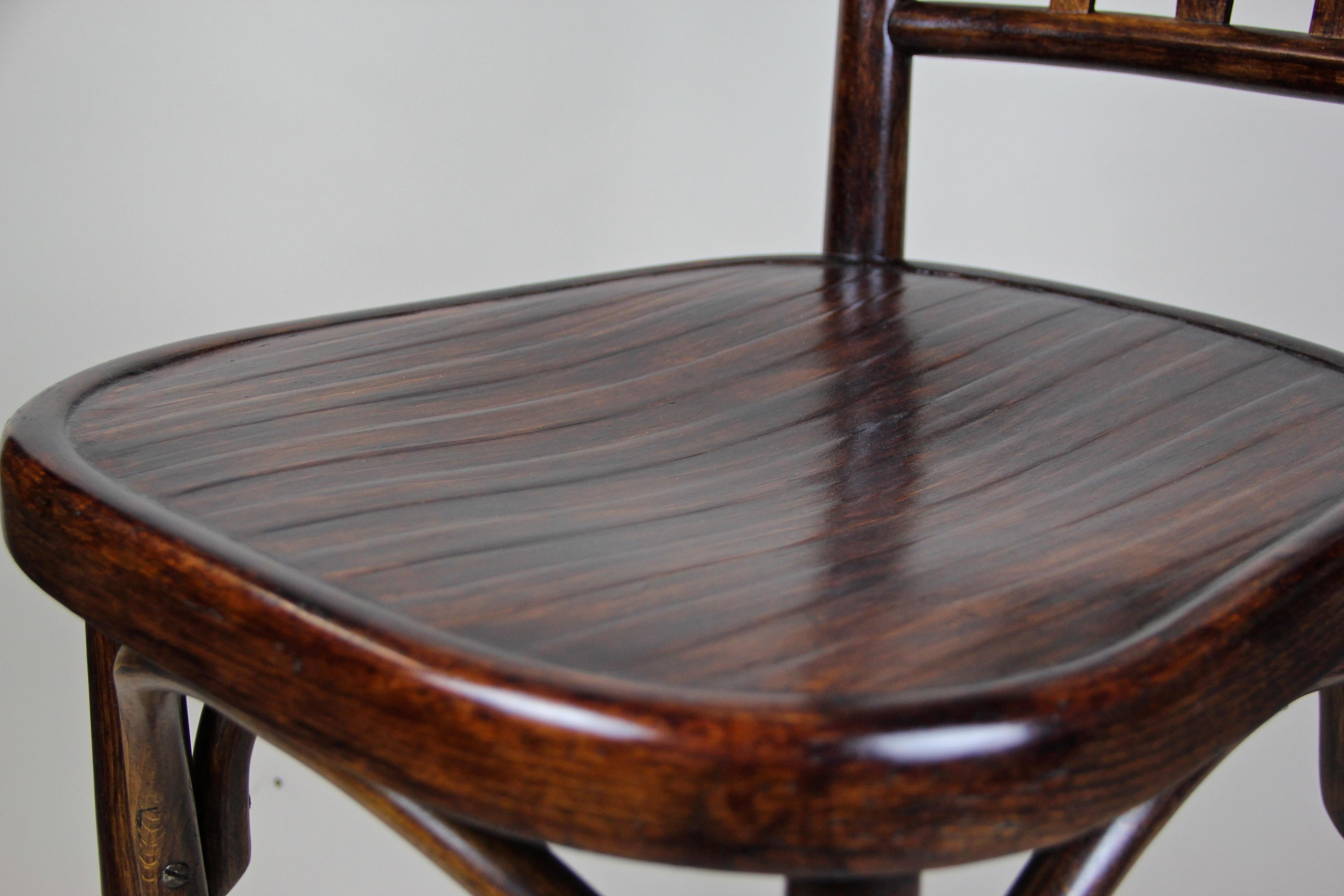 Superb bentwood chair by Fischel Vienna from the early Art Nouveau period in Austria circa 1905. This beautiful early 19th century chair was produced of bent beech wood and trimmed to a dark nut wood look. The seat shows a fantastic worked surface