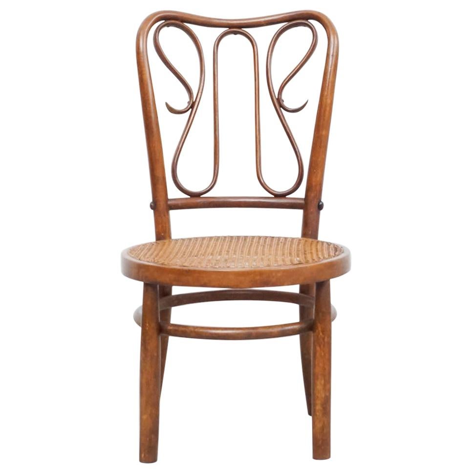Chaise en bois cintré dans le style de Thonet, rotin et bois, vers 1940