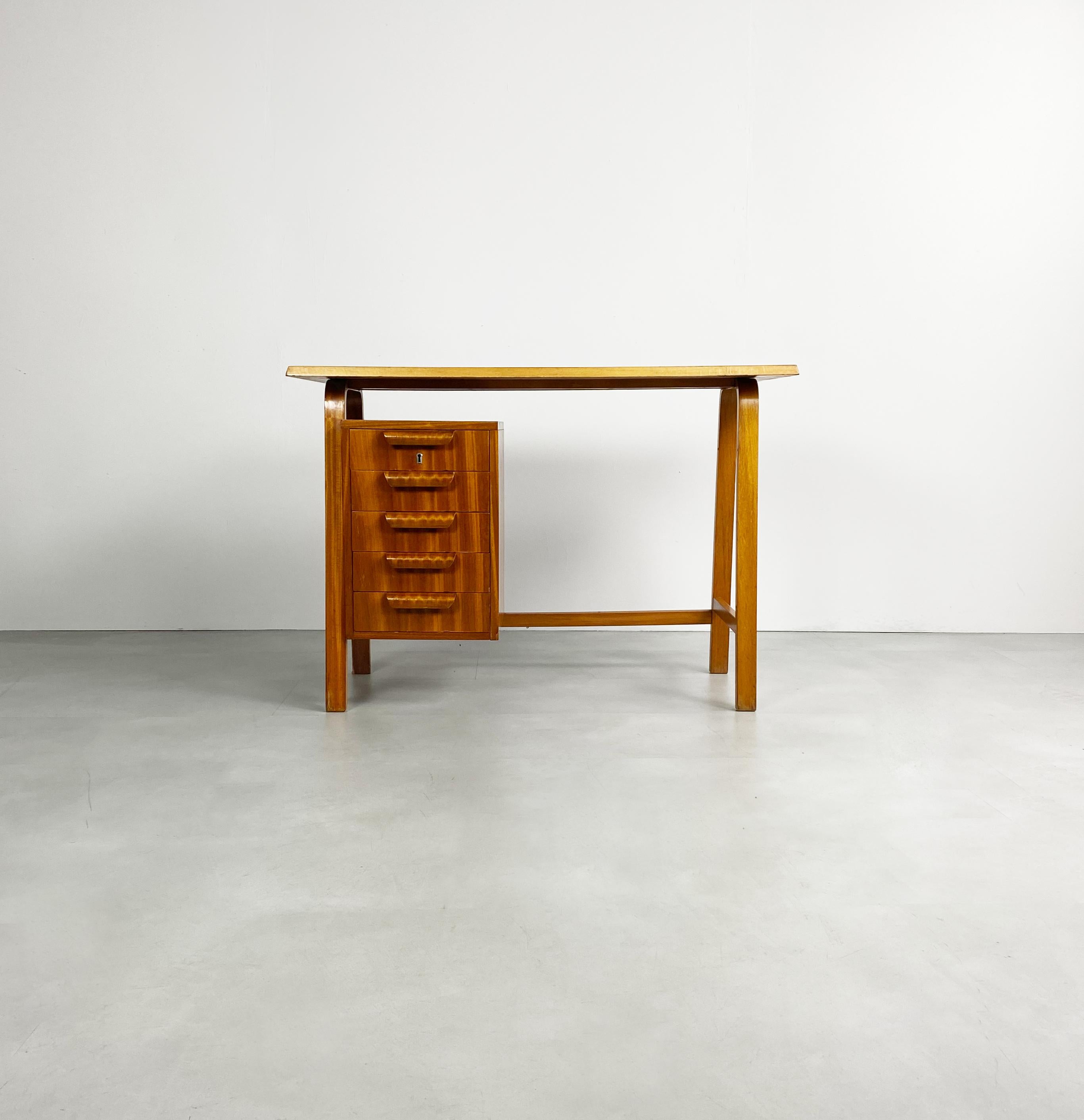 Compact bentwood desk by British design icon Gordon Russell. Manufactured in the 1950's. The design has strong similarities with those of Alvar Aalto. 

Dimensions (cm, approx): 
Height: 69 
Width: 99 
Depth: 45

Good condition for year.