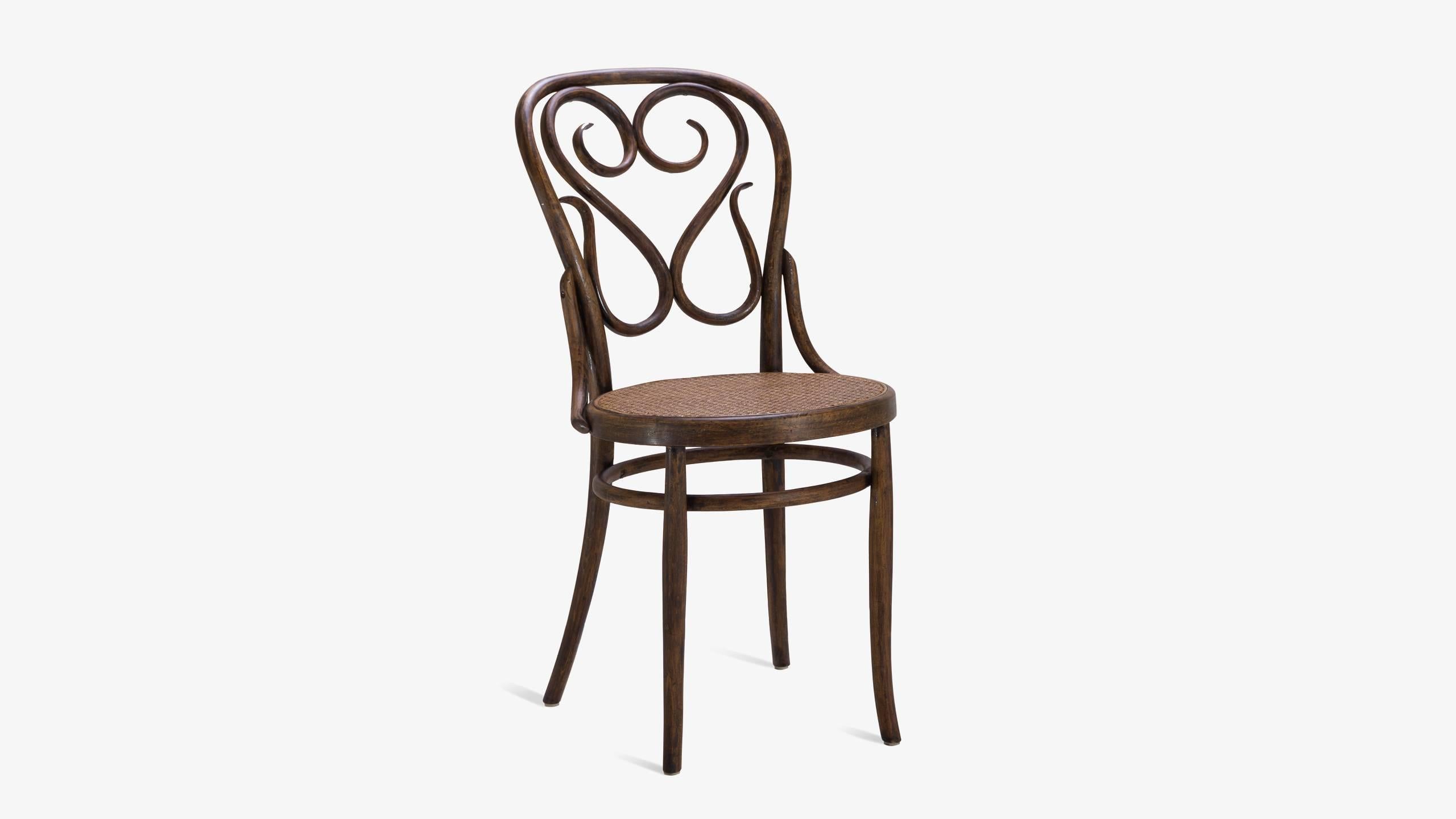 An exquisite example of fine Italian Craftsmanship very much in the style of Thonet. These chairs feature intricate woodwork that is wonderfully visually seductive. Their origins are from Modena, Italy where the great late craftsman Salvatore Leone