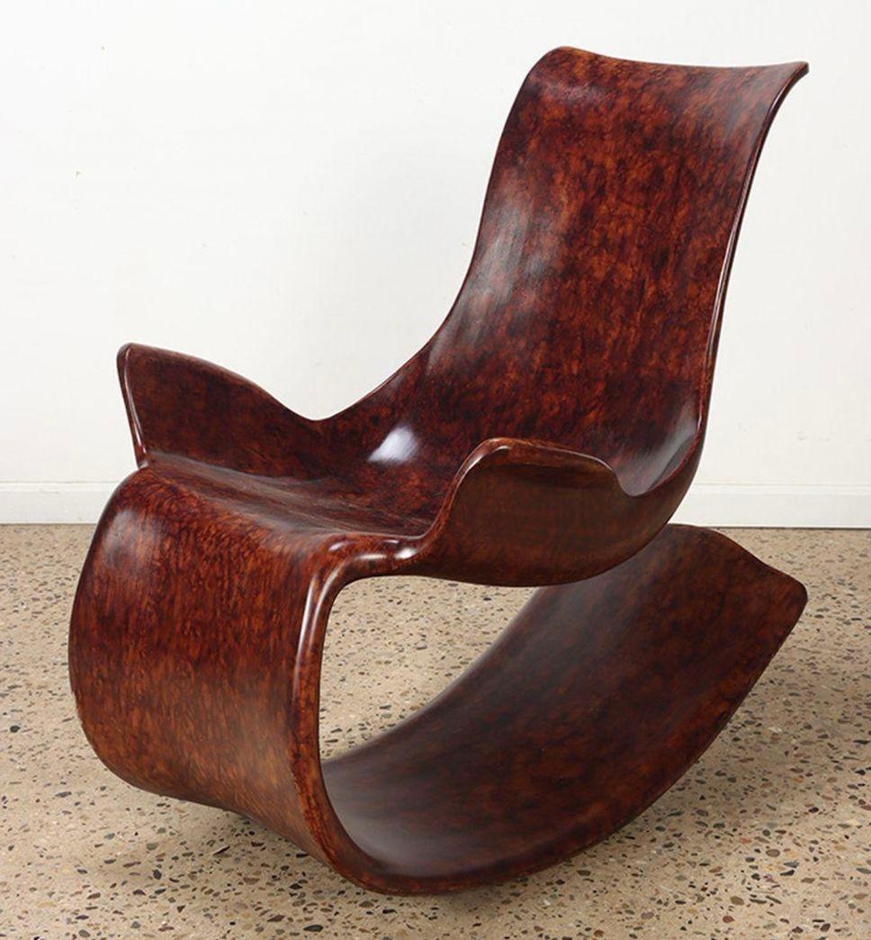 Abstract design bentwood modern rocking chair with faux burl finish.
 
Dimensions:
38.25