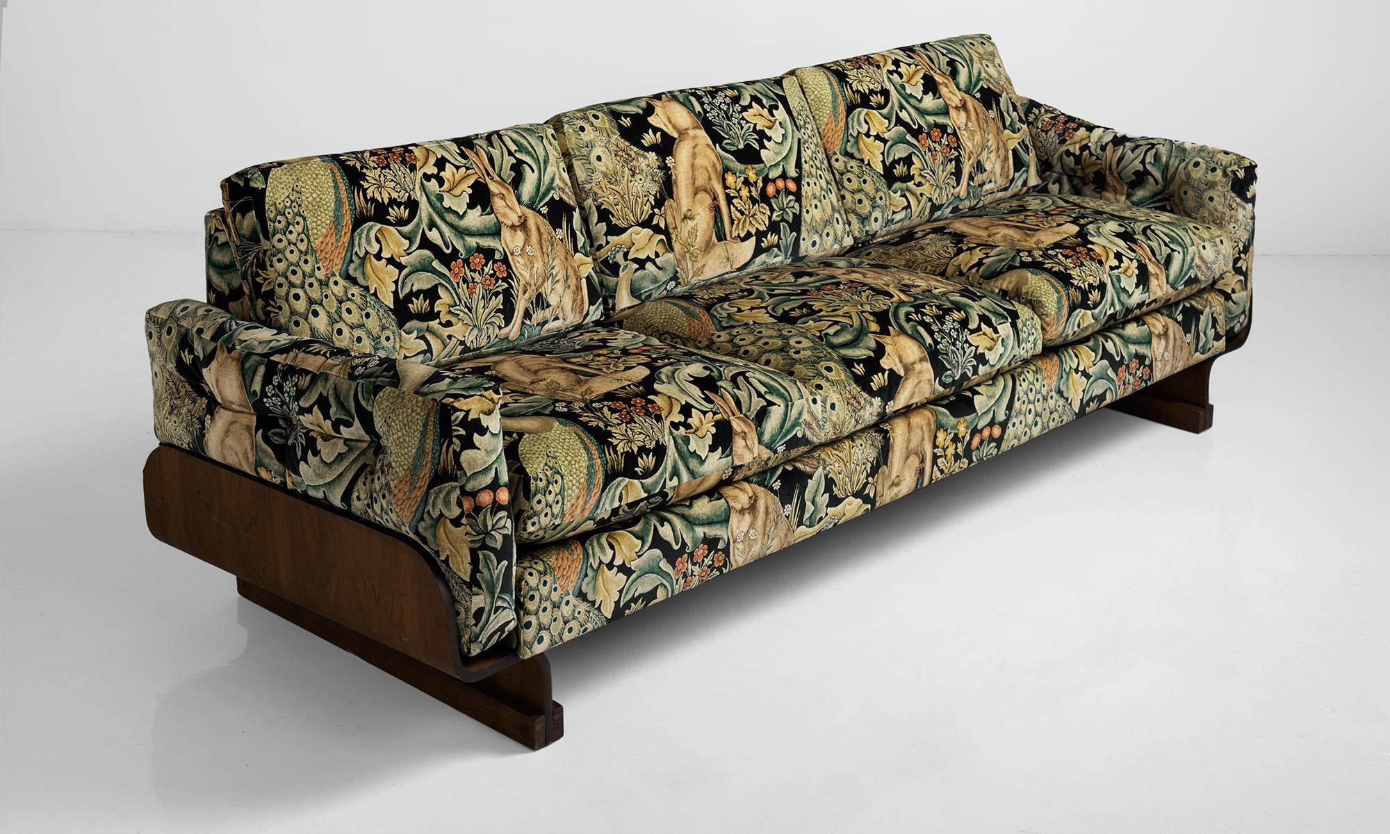 Bentwood modern sofa, America, circa 1960.

Low sofa, newly upholstered in William Morris fabric depicting a lively forest scene.