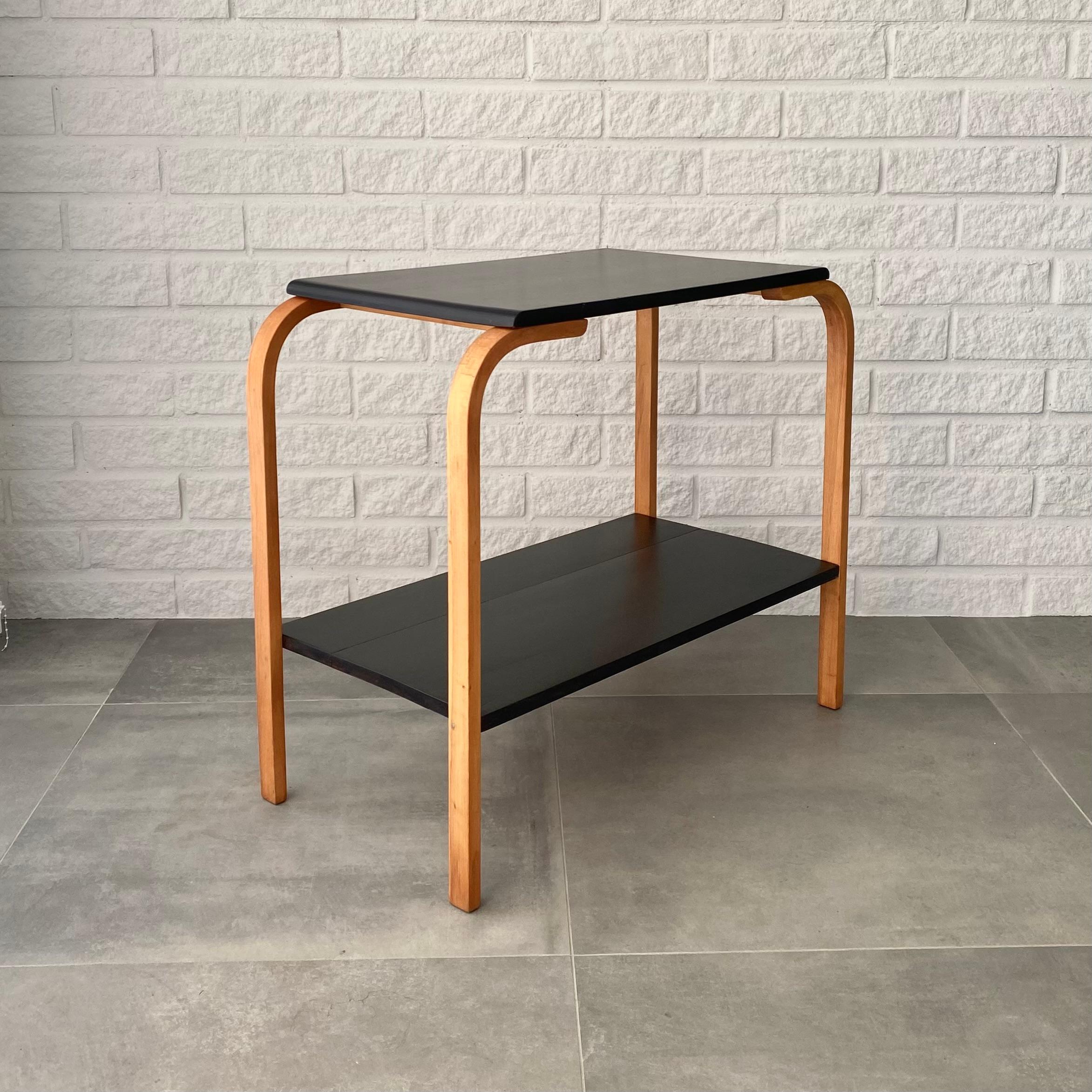 Rectangular side table with four bentwood legs made from solid beech, black tabletop and shelf. Produced in Sweden in the 1930s by Gemla Fabriker in the small community of Diö. The manufacturer Gemla was founded in 1861, and soon Bohemian craftsmen