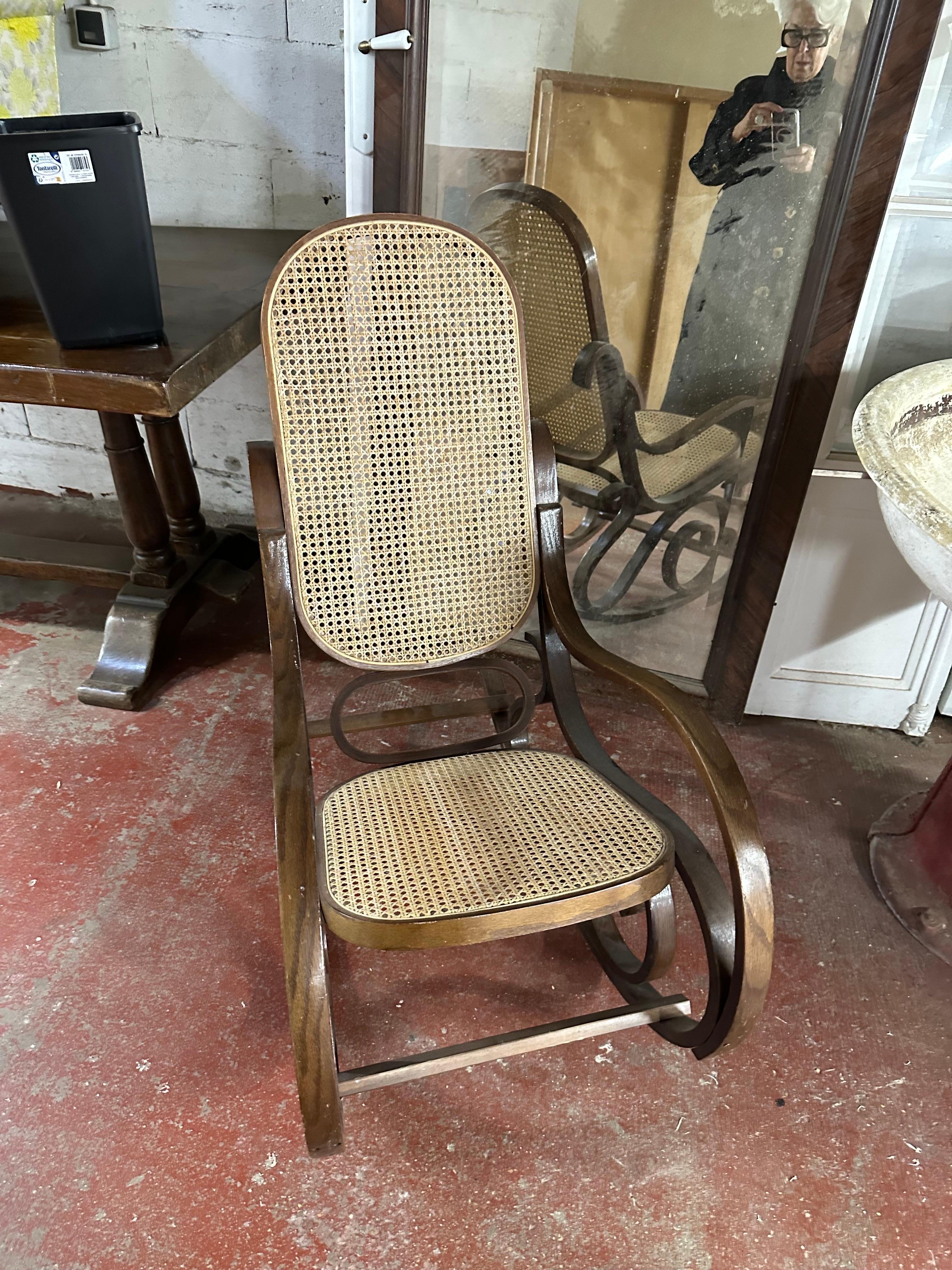 An attributed thonet rocking chair as it is not signed in good condition
 in tinted beech.