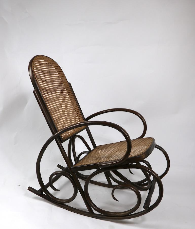 Nice large bentwood and cane rocking chair, made in Spain after the Classic Thonet model. This example is circa 1960-1970's it is in very Fine, original, clean and ready to use condition.