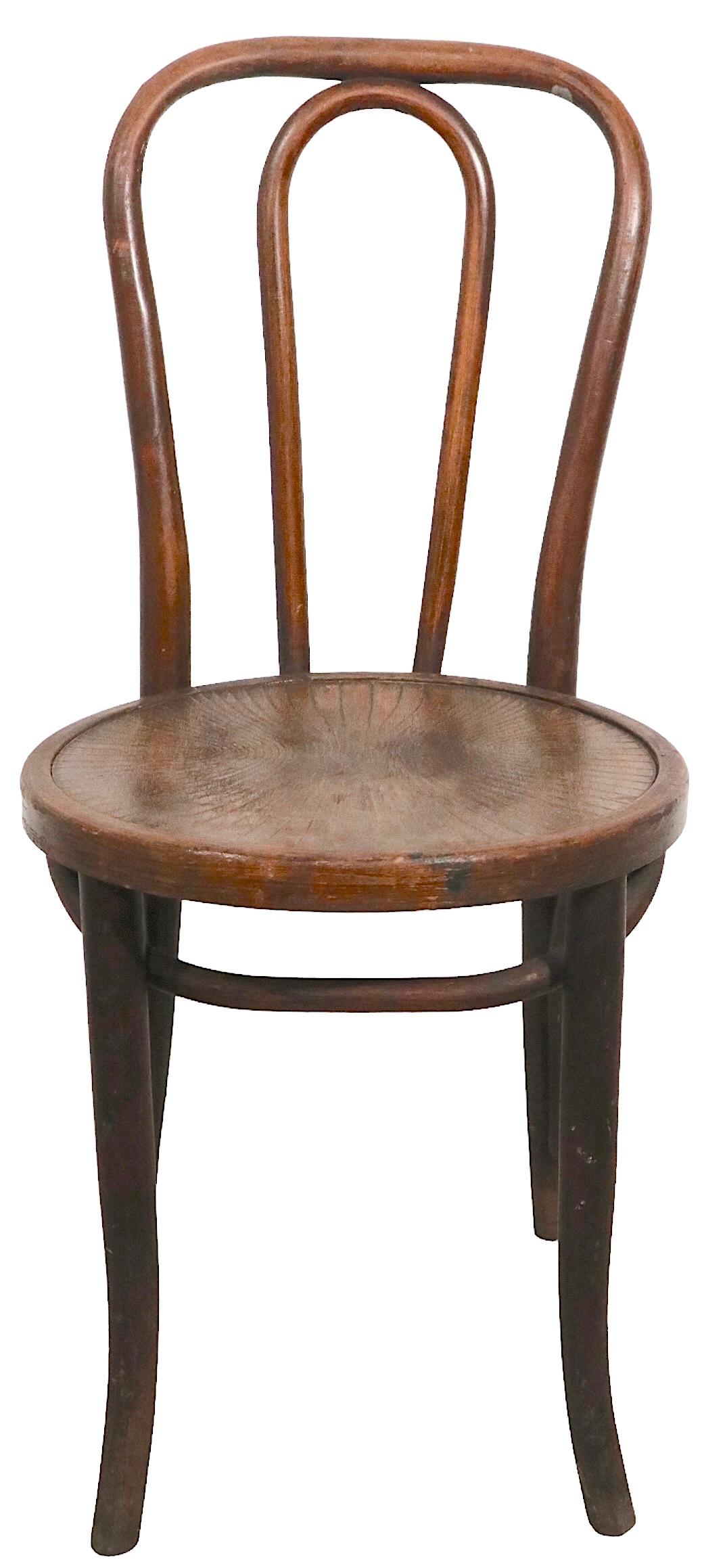 Classic bentwood side chair in the Viennese Secessionist style, circa 1920 - 1950. The chair is in good, original, estate condition, sturdy and stable, showing cosmetic wear to finish, and general signs of age. Possibly Thonet, Kohn, Fishel etc,