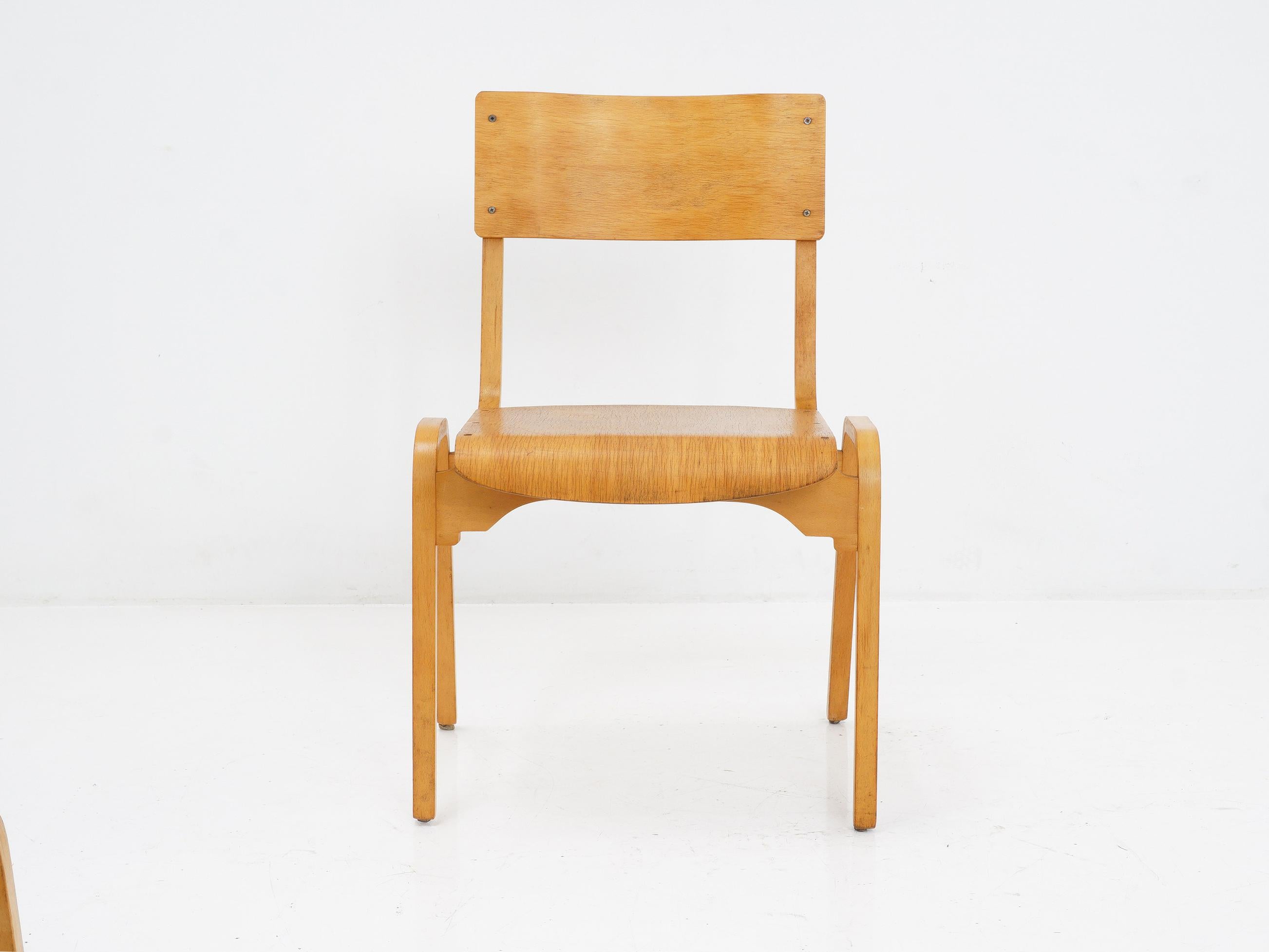 If you're looking for a chair with some real curves, these laminated stacking bentwood dining chairs designed by Stafford and made by Tecta Furniture Ltd. are just the ticket. Not only are they stylish, but they're also stackable for easy