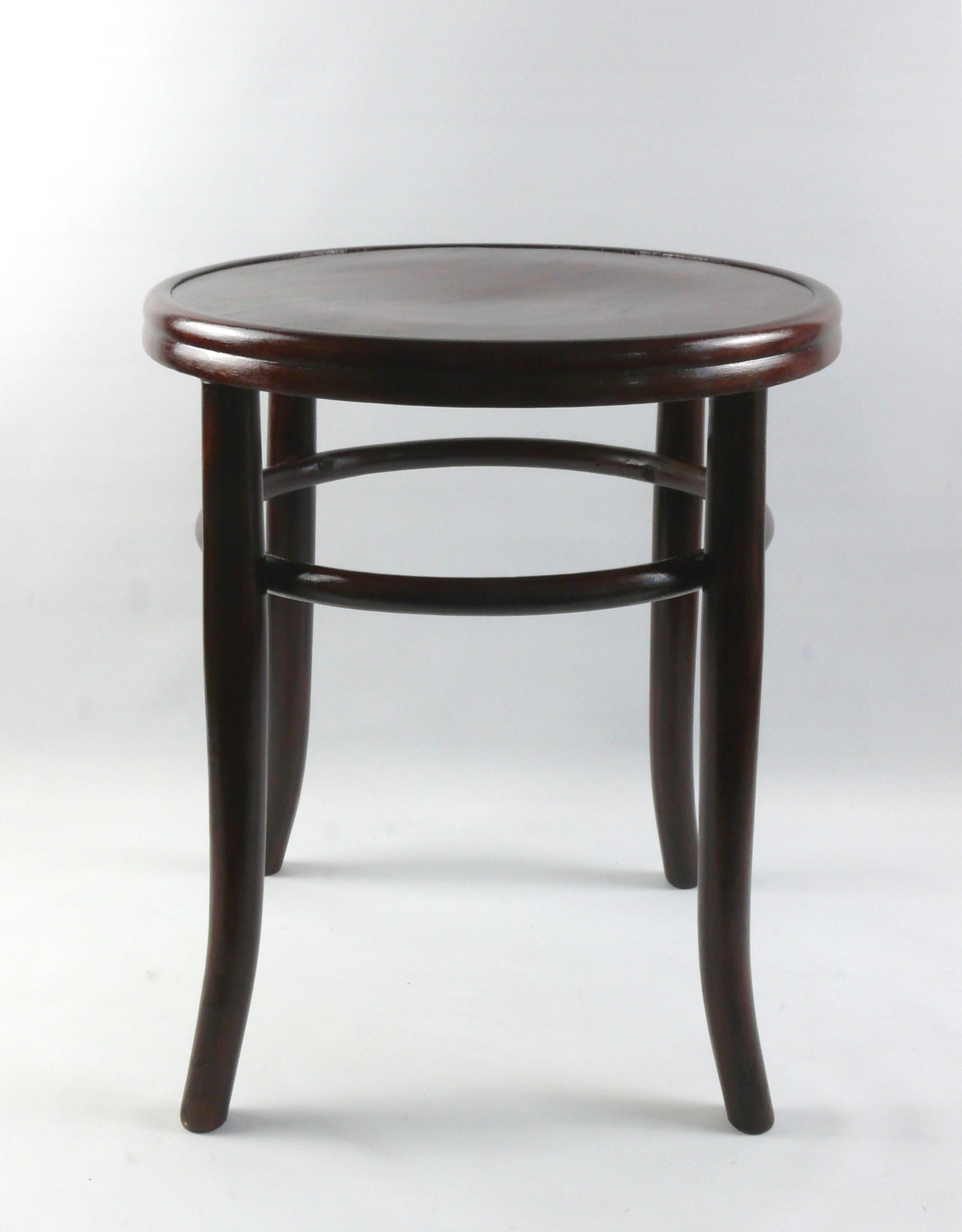 Restored bentwood stool - beech, around 1900. The stool is made of bent beech wood and has a bentwood ring below the seat for stability. Michael Thonet developed this construction principle and applied it to many of his chairs and stools. The seat