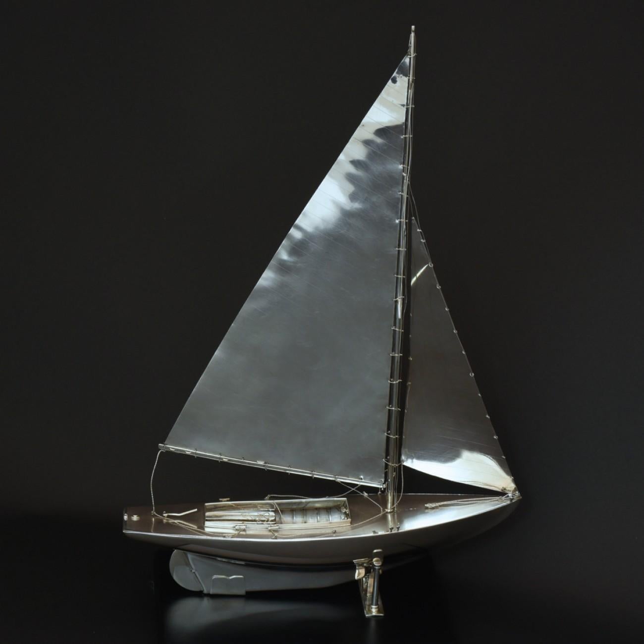 An exceptional scale model of a Mylne O.D. class yacht made in sterling silver, hall marked 1935. Beautifully detailed, it even has sterling silver rigging and sails!

Benzie of Cowes was established in 1862 by the late Mr. Simpson Benzie. Through